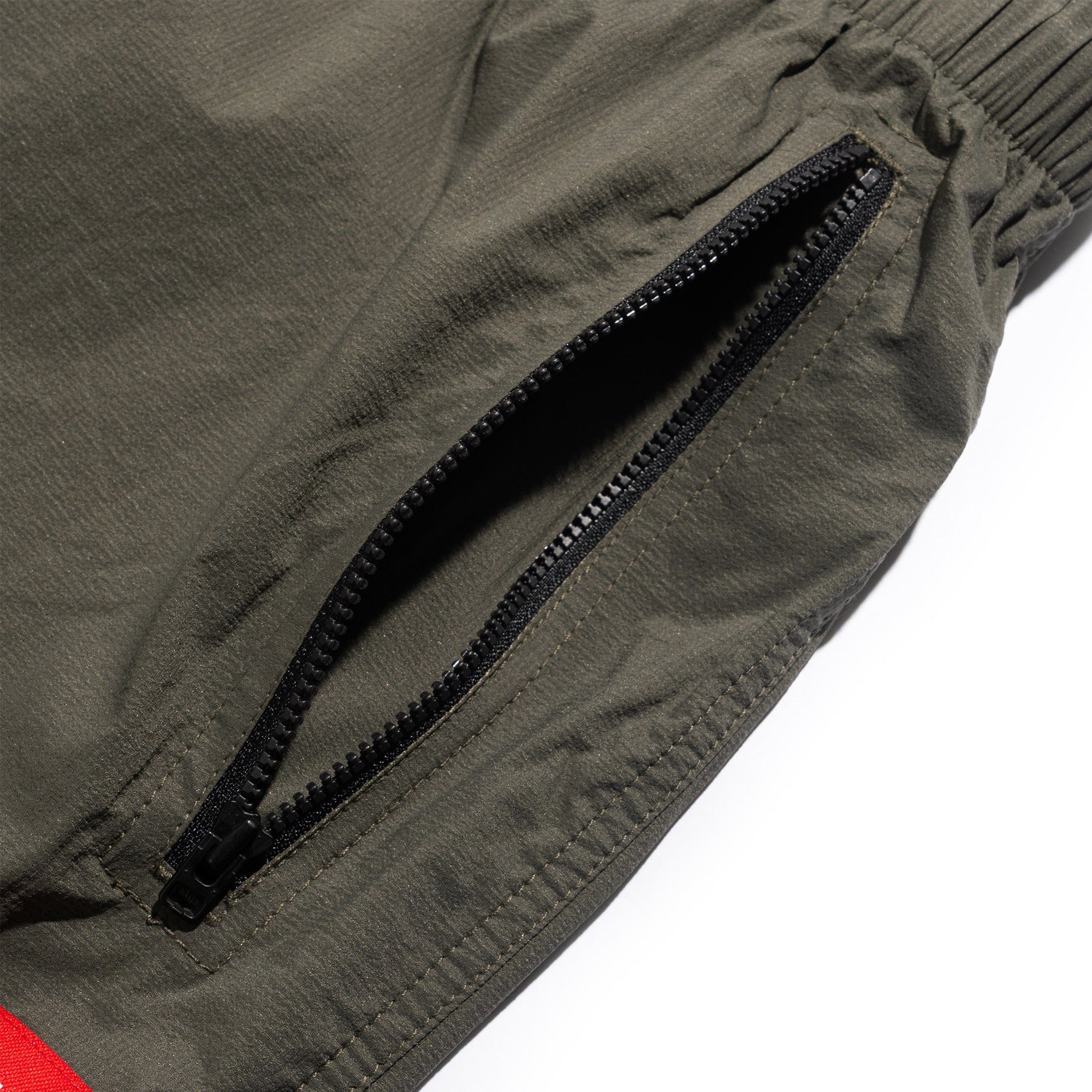 The North Face TNF Red Box Wind Pants Taupe Green NF0A8EFV21L1