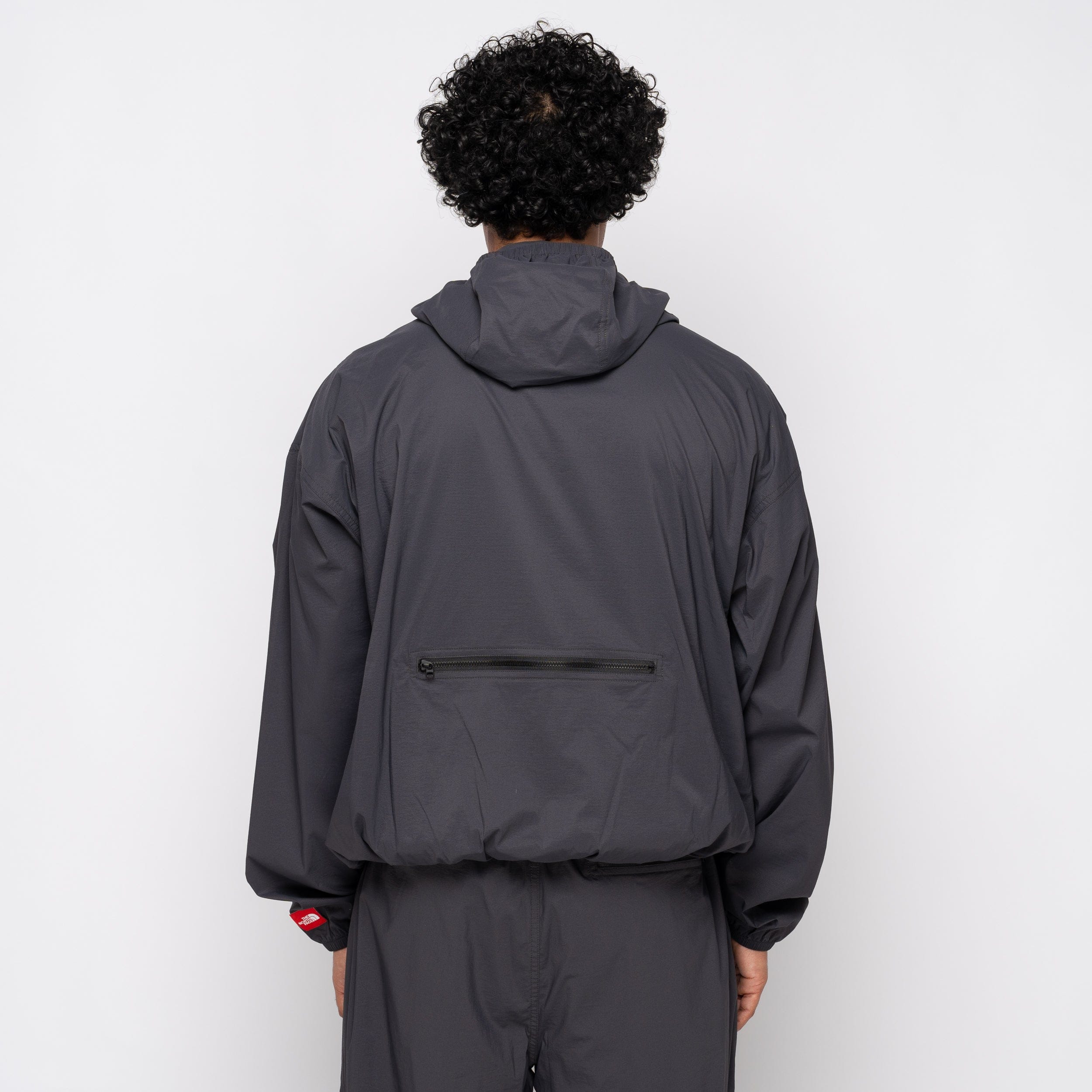 The North Face TNF Red Box Wind Jacket Obsidian NF0A8EFW