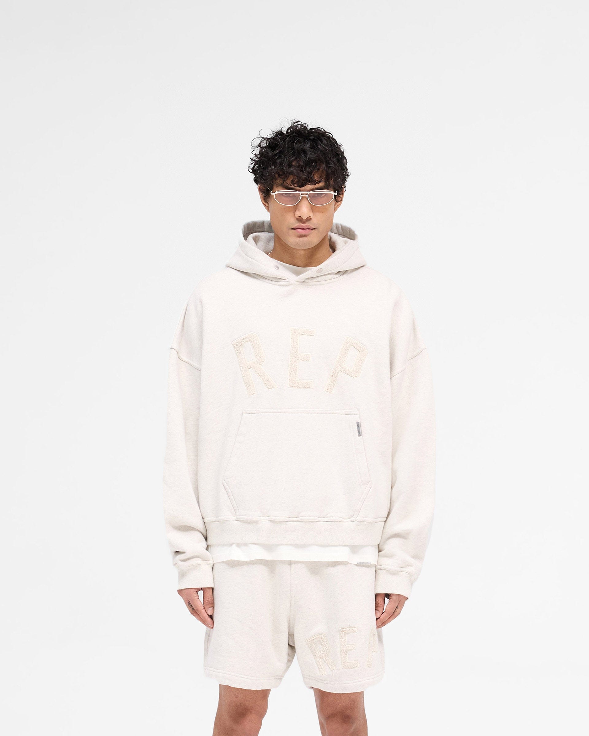 SS25 Rep Applique Hoodie - Cream Marl