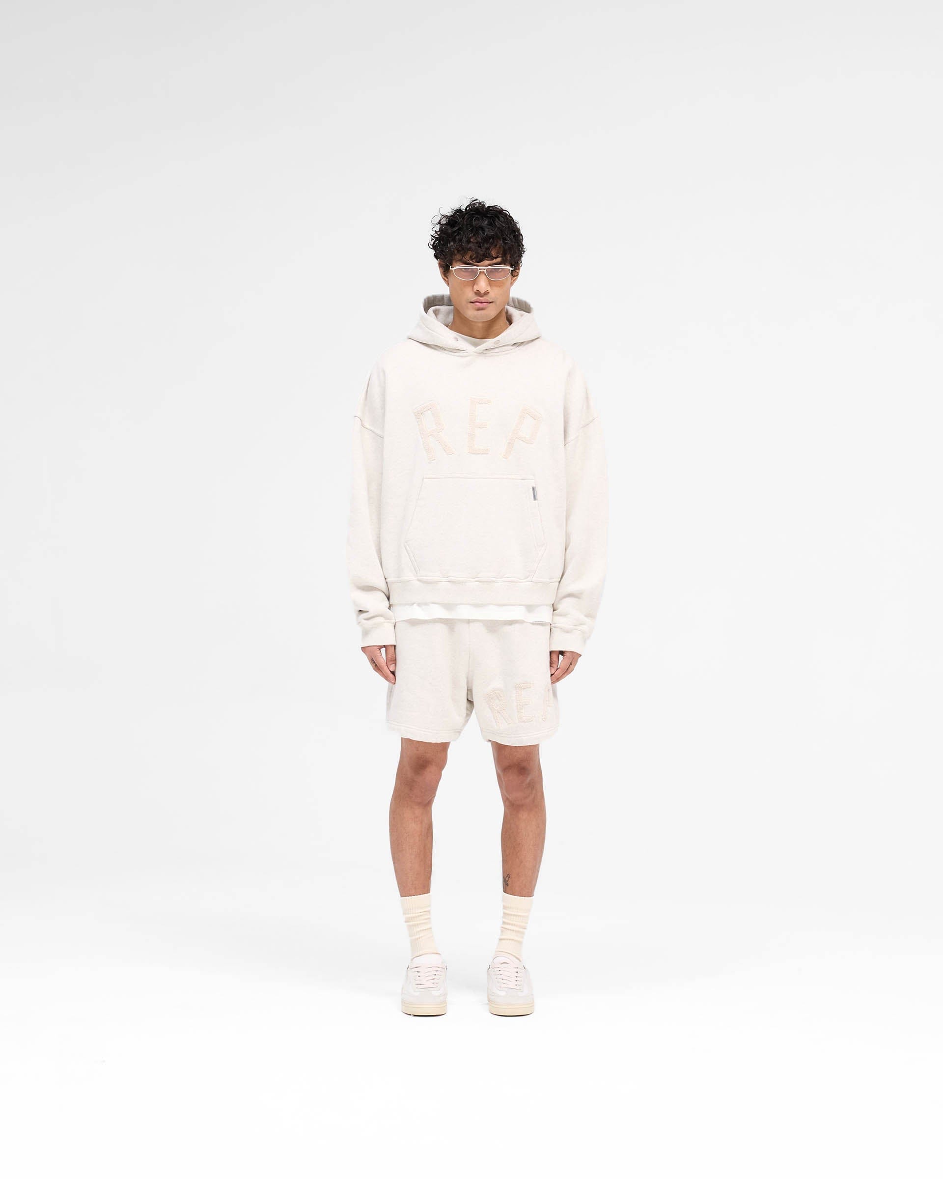 SS25 Rep Applique Hoodie - Cream Marl
