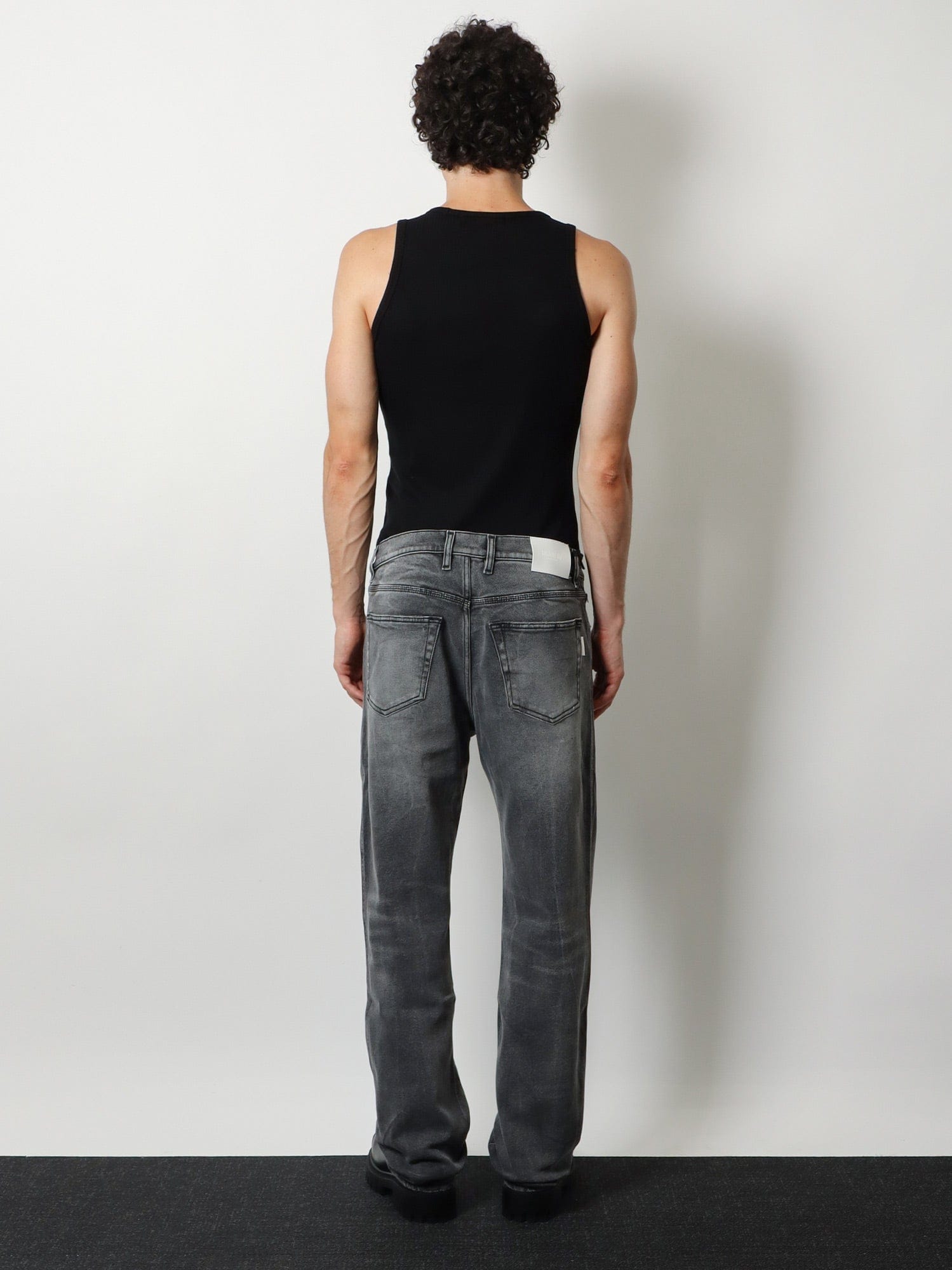 NUMERI 123456789 Denim trousers with back logo patch