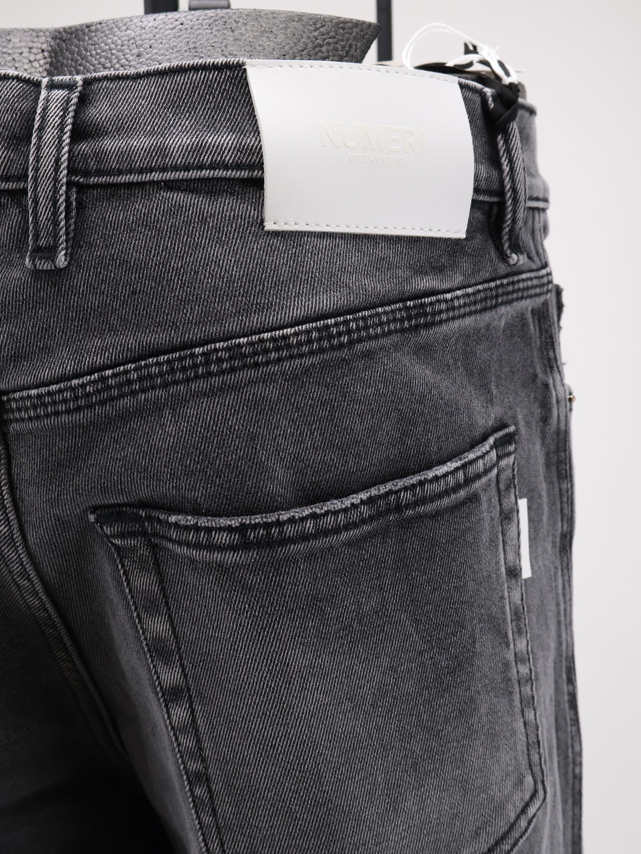 NUMERI 123456789 Denim trousers with back logo patch