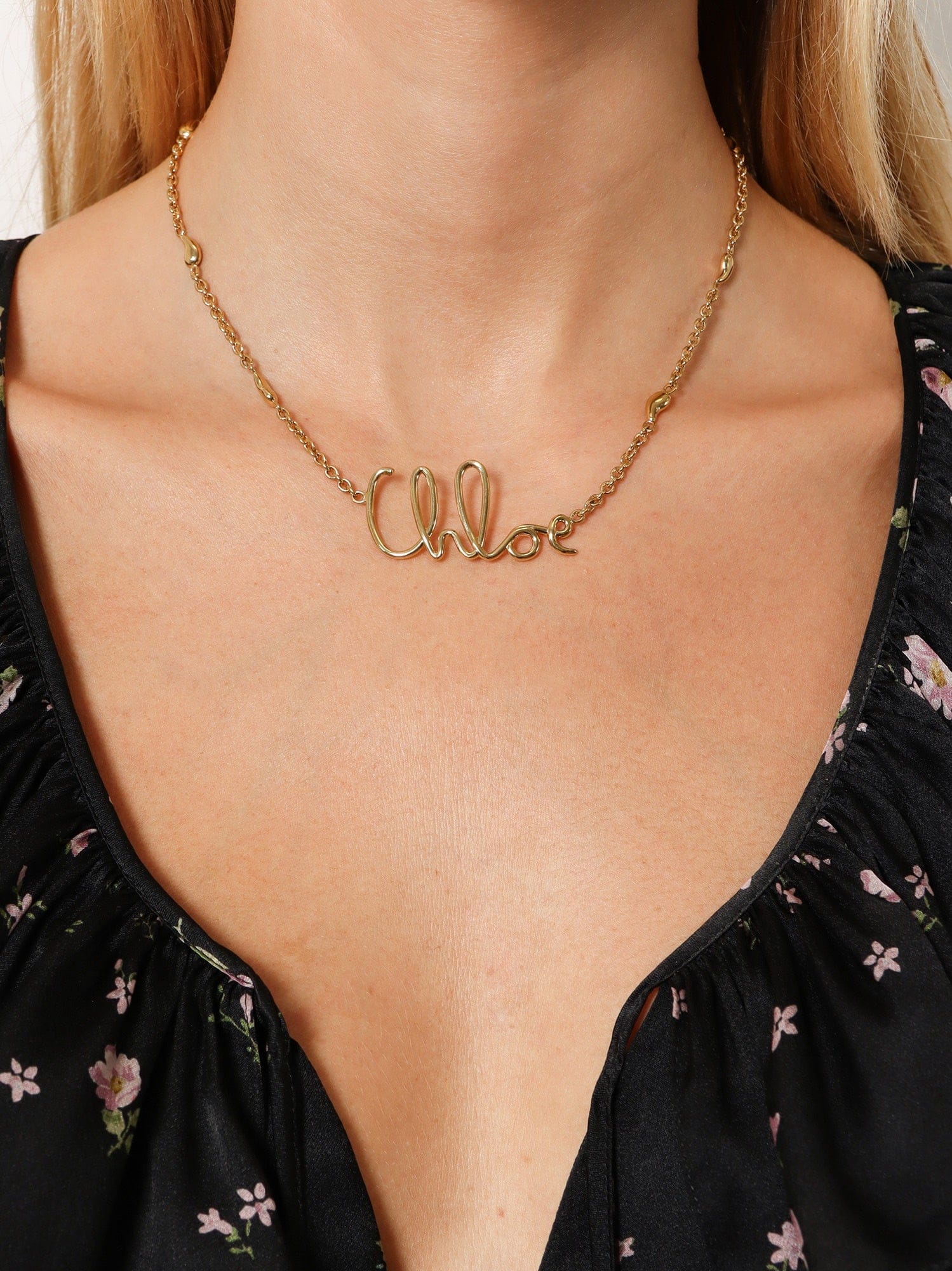 Chloe Brass necklace with lettering logo