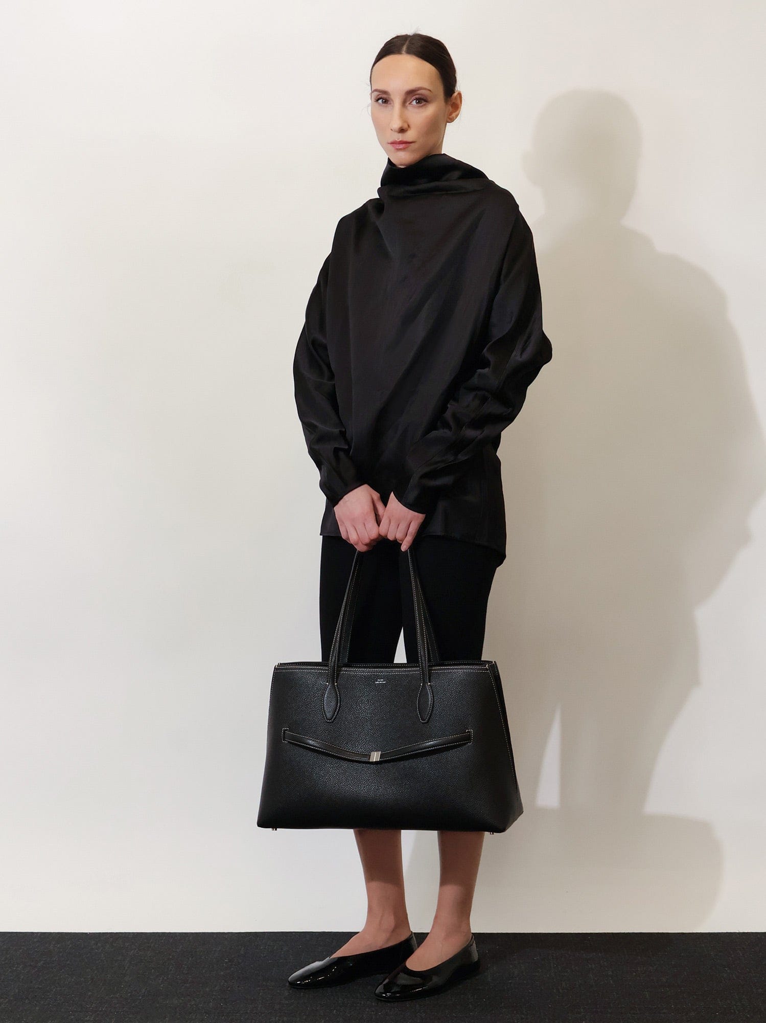 TOTEME Leather shoulder bag with lettering logo on the front