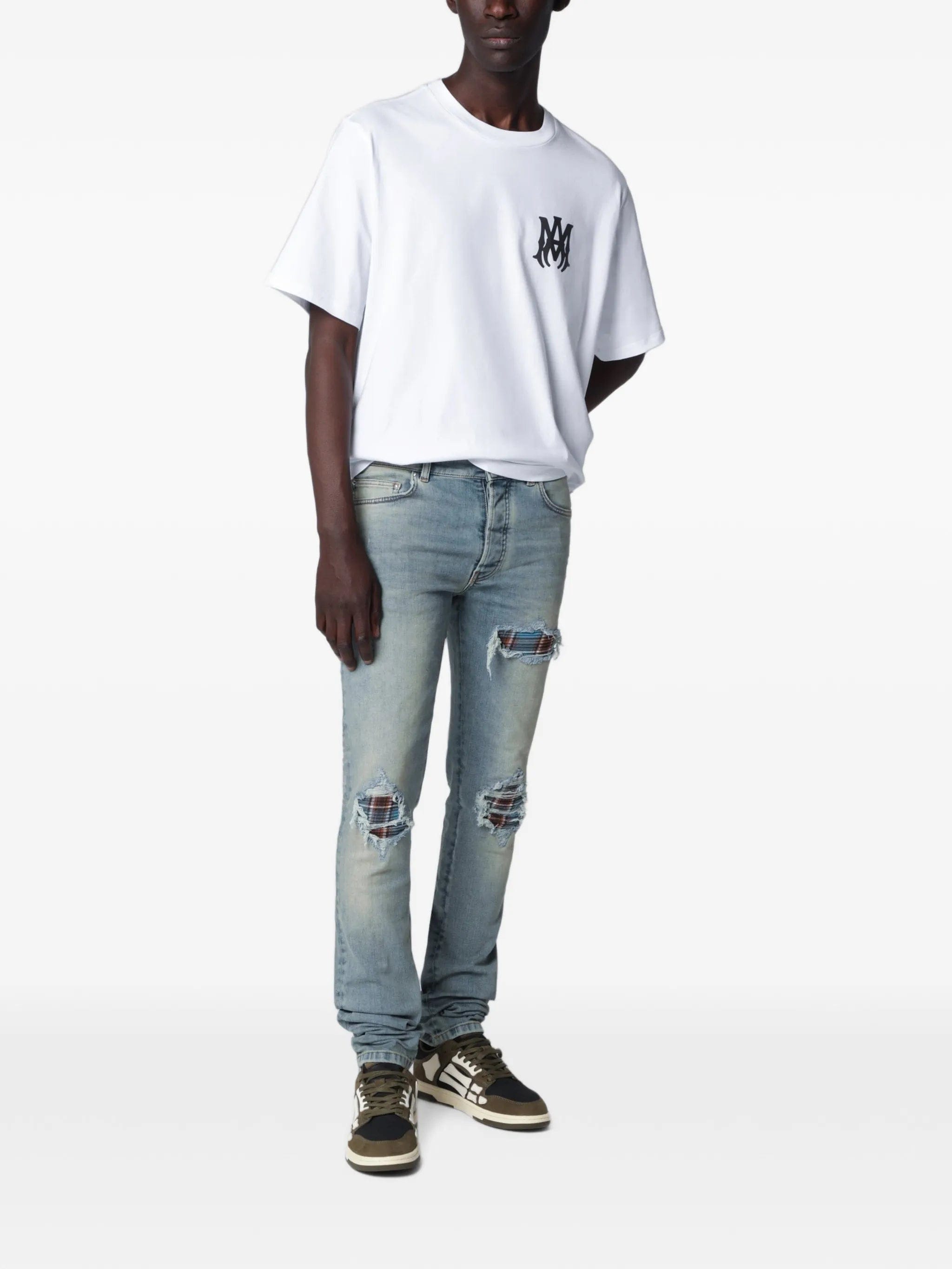 Amiri distressed-effect patched jeans