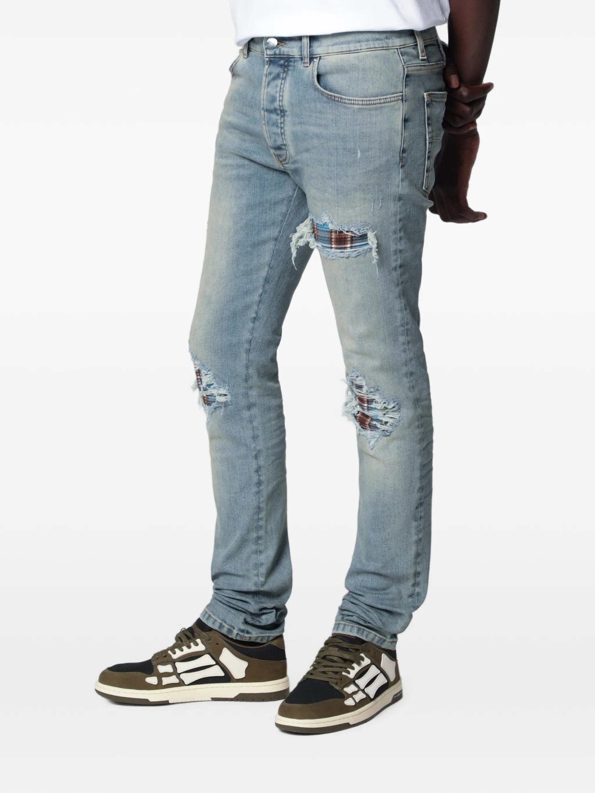 Amiri distressed-effect patched jeans