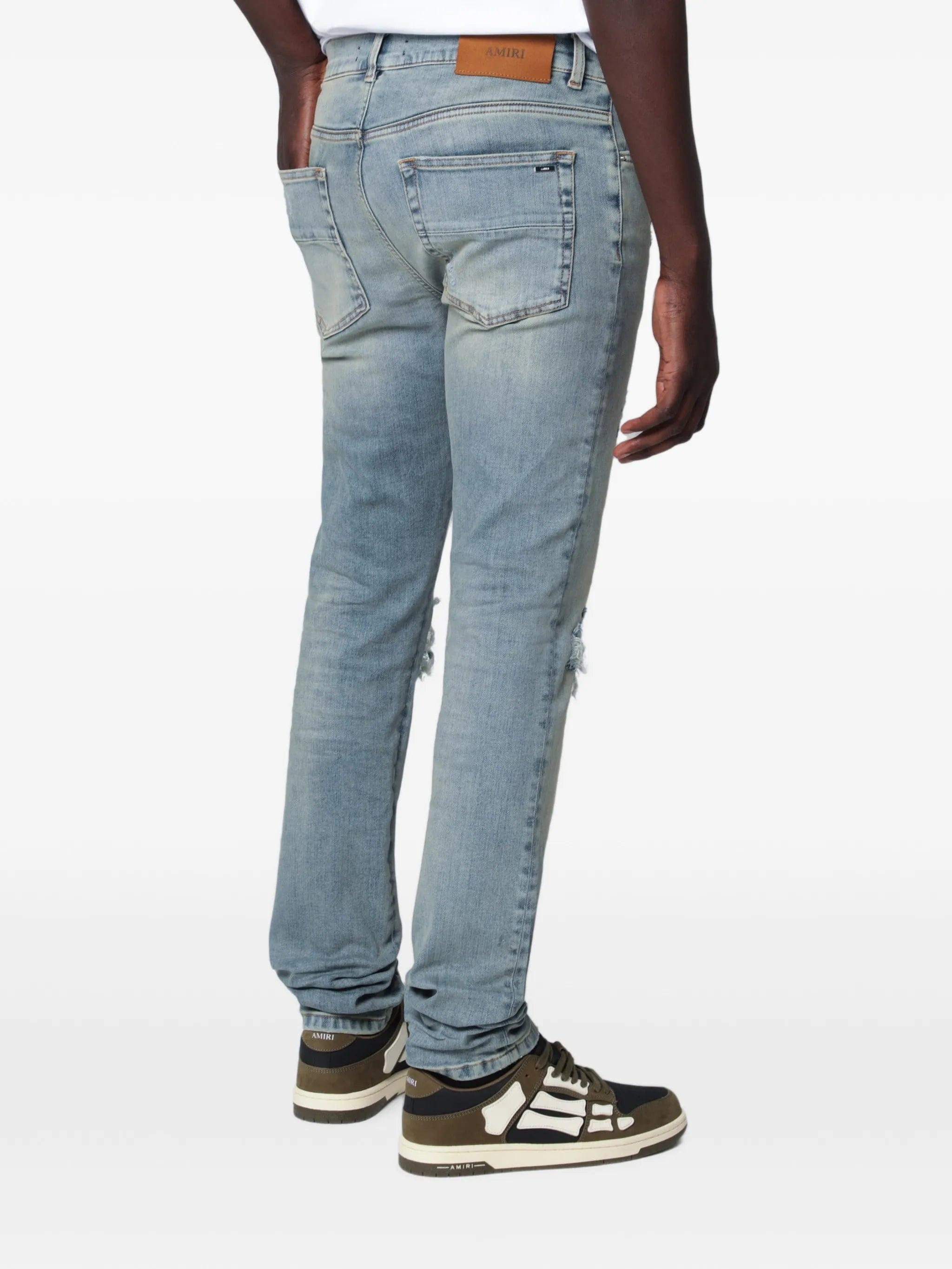 Amiri distressed-effect patched jeans