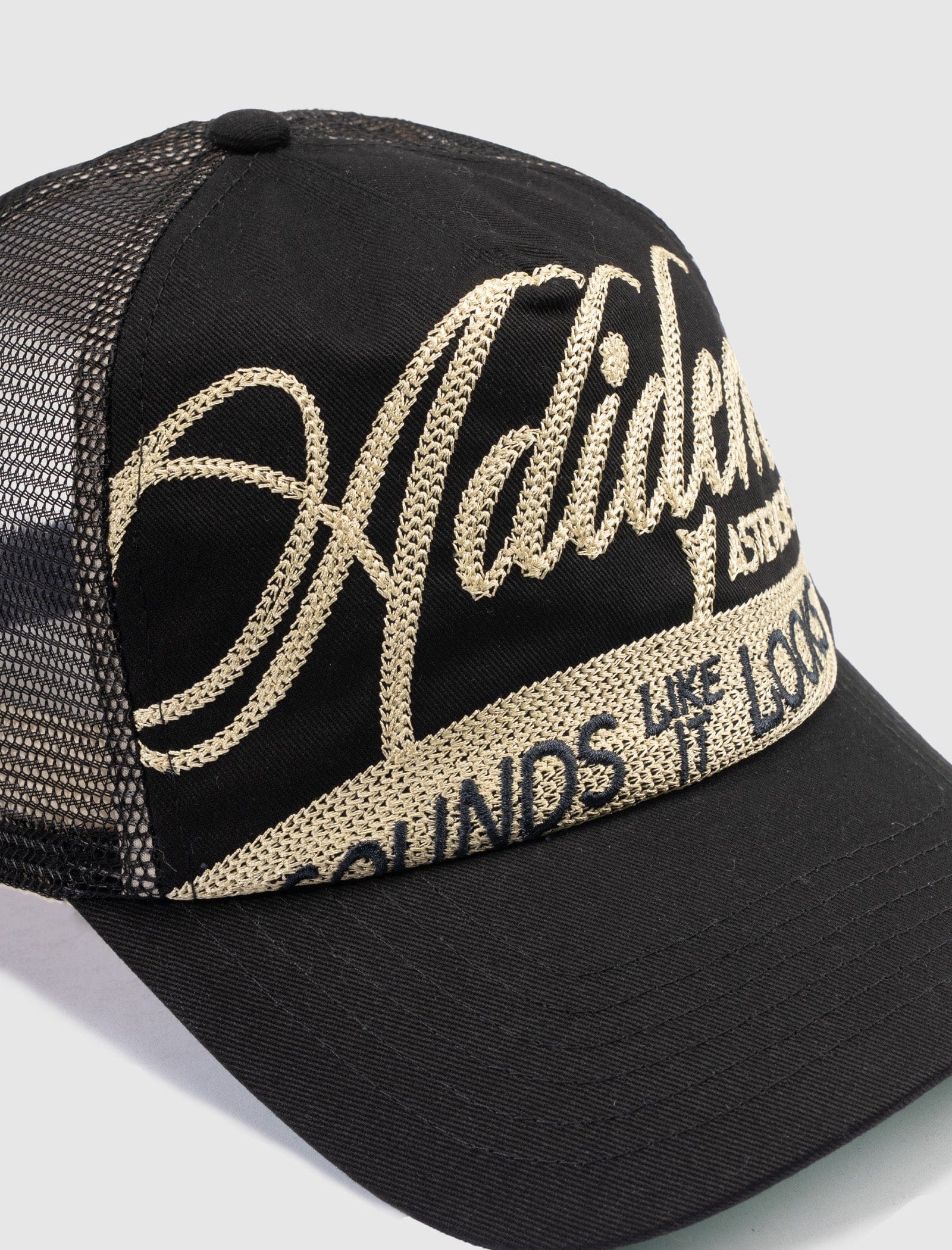 ADIDEM ASTERISKS CURSIVE TRUCKER HAT