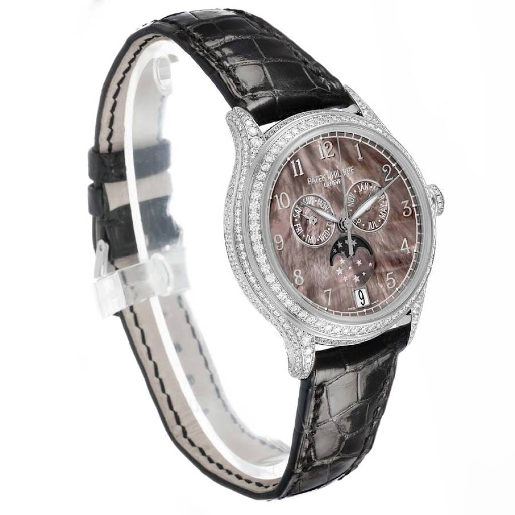 Complications (Reference 4948G). A 38mm white gold diamond-set automatic wristwatch with date, day, month, moon phase, and annual calendar.