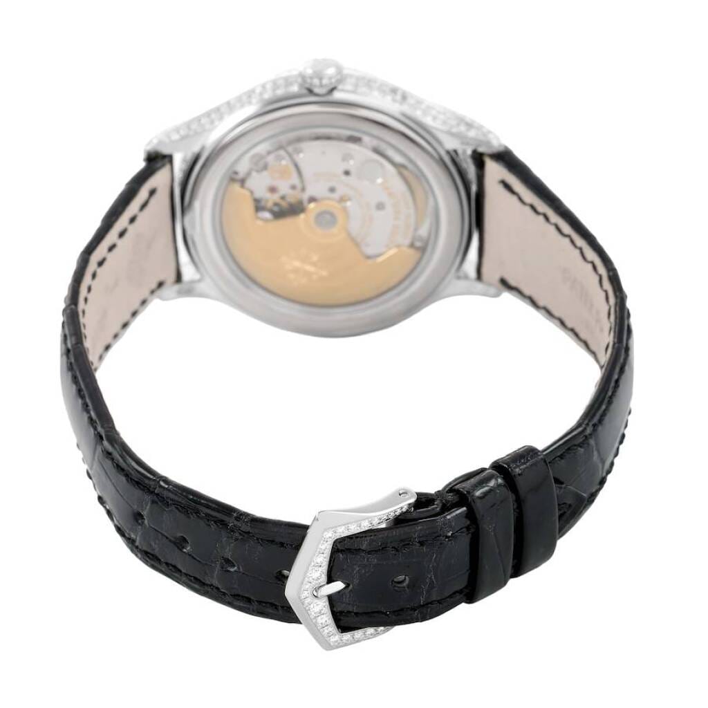 Complications (Reference 4948G). A 38mm white gold diamond-set automatic wristwatch with date, day, month, moon phase, and annual calendar.