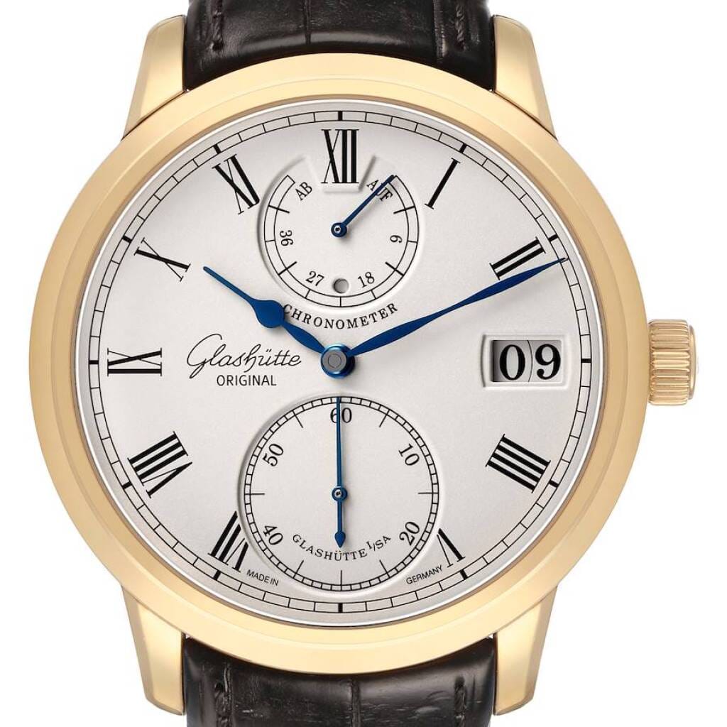 Senator Chronometer (Reference 1-58-01-01-01-04). A 42mm yellow gold manual wind wristwatch with date, power reserve, and day/night indicator.