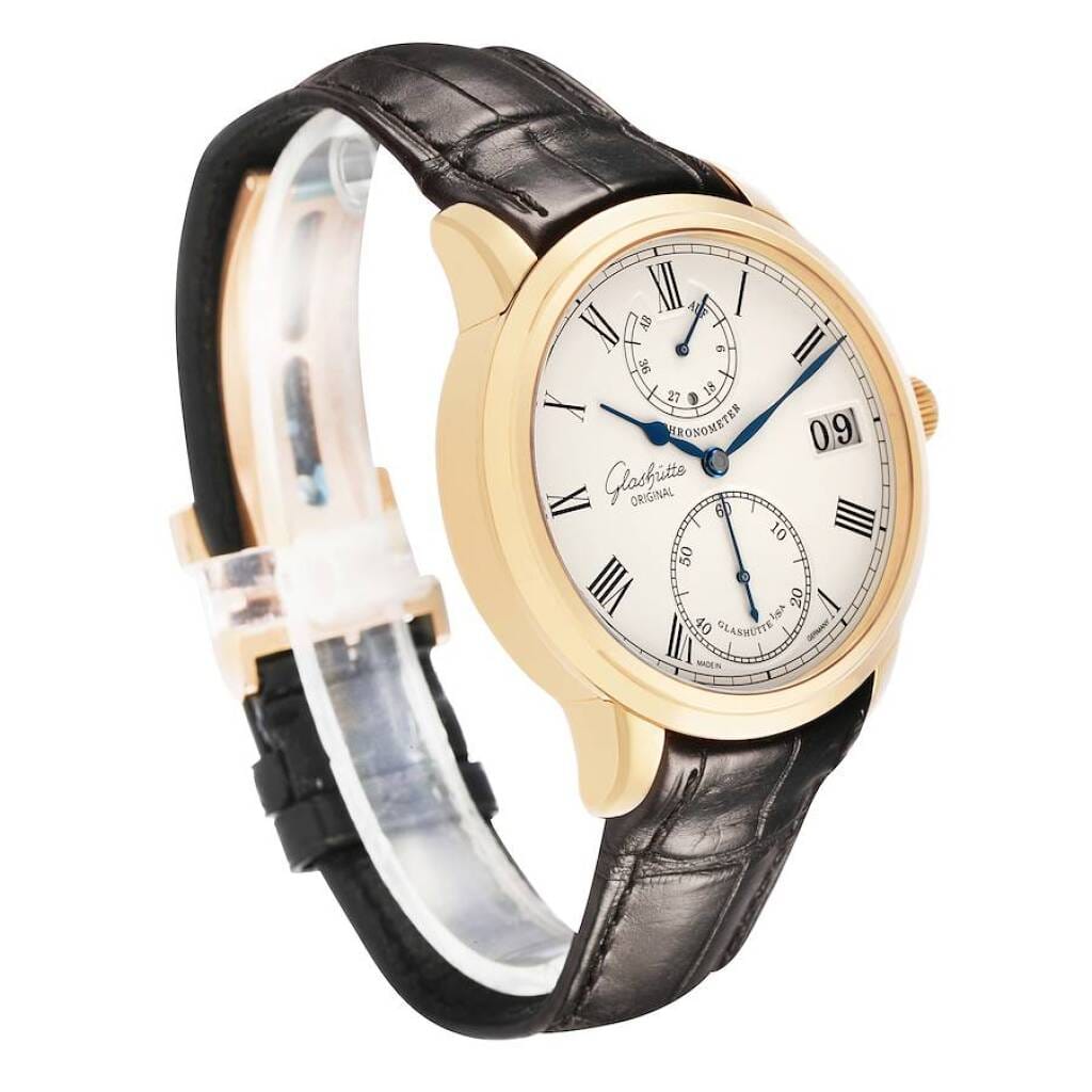 Senator Chronometer (Reference 1-58-01-01-01-04). A 42mm yellow gold manual wind wristwatch with date, power reserve, and day/night indicator.