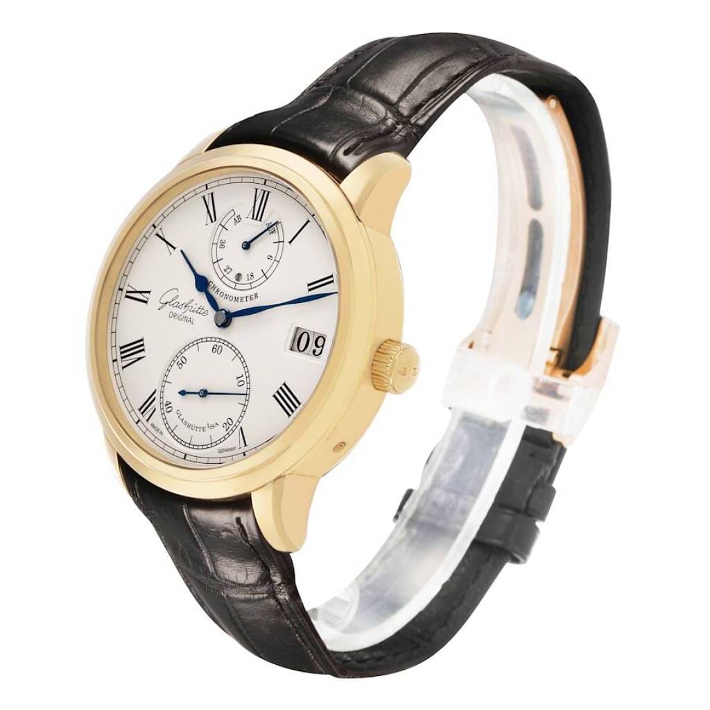 Senator Chronometer (Reference 1-58-01-01-01-04). A 42mm yellow gold manual wind wristwatch with date, power reserve, and day/night indicator.