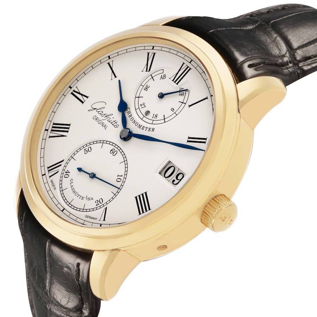 Senator Chronometer (Reference 1-58-01-01-01-04). A 42mm yellow gold manual wind wristwatch with date, power reserve, and day/night indicator.