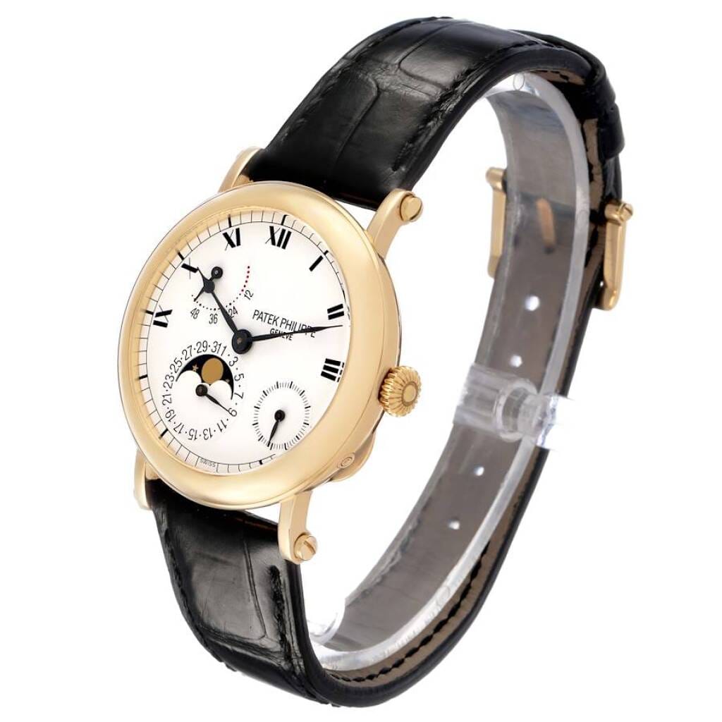 Complications (Reference 5054J). A 36mm yellow gold automatic wristwatch with date, moon phase, and power reserve. 2000