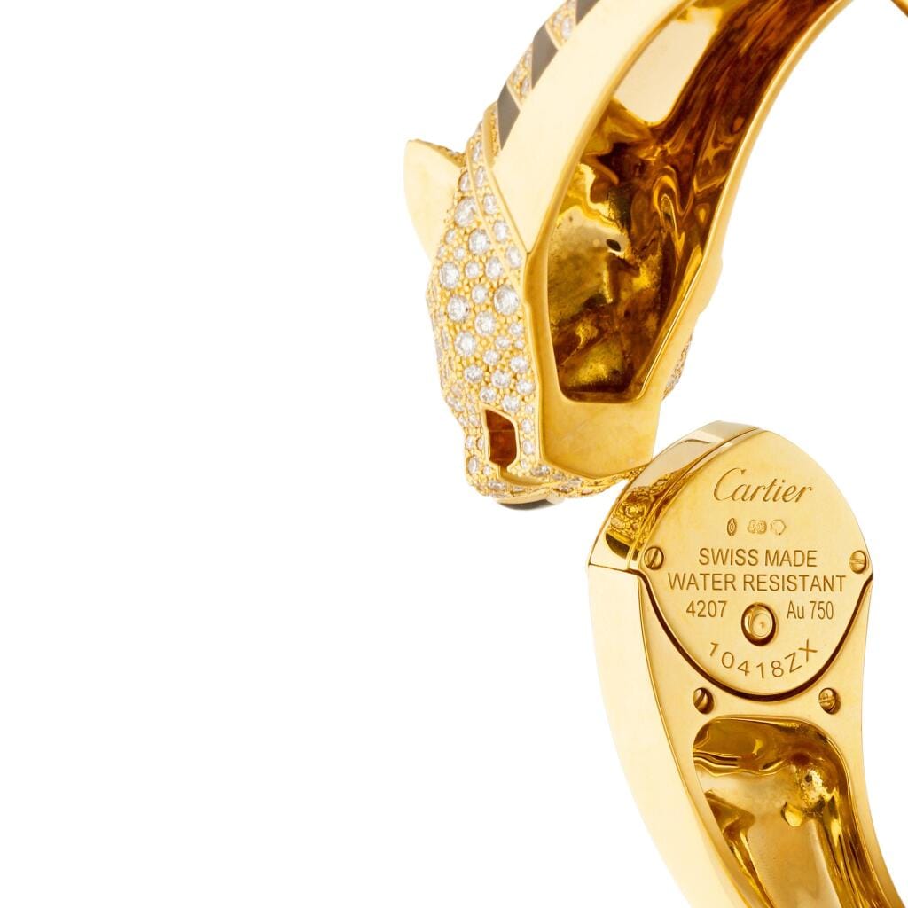 La Panthère de Cartier (Reference HPI01219). A 18mm yellow gold diamond and emerald-set quartz bangle watch. 2018
