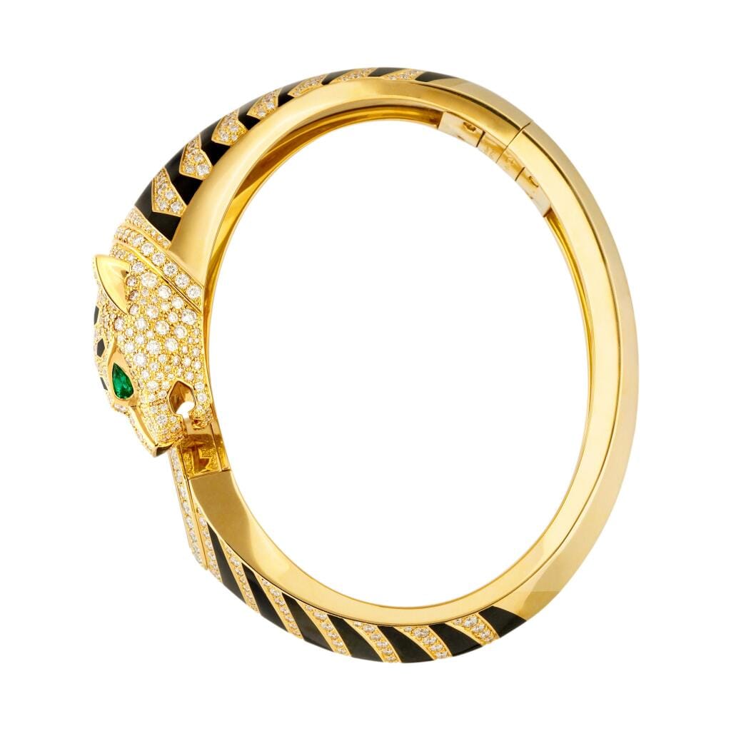 La Panthère de Cartier (Reference HPI01219). A 18mm yellow gold diamond and emerald-set quartz bangle watch. 2018