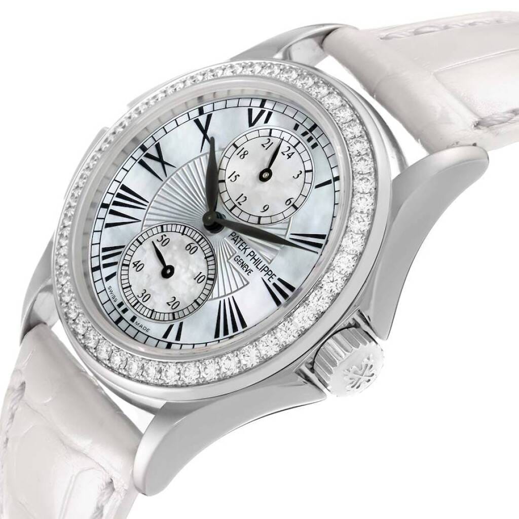 Calatrava Travel Time (Reference 4934G-001). A 35mm white gold diamond-set manual wind wristwatch with dual time.