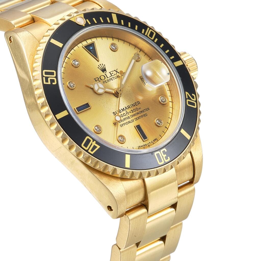 Submariner (Reference 16618). A yellow gold, diamond and sapphire-set automatic wristwatch with date and bracelet. Circa 1991