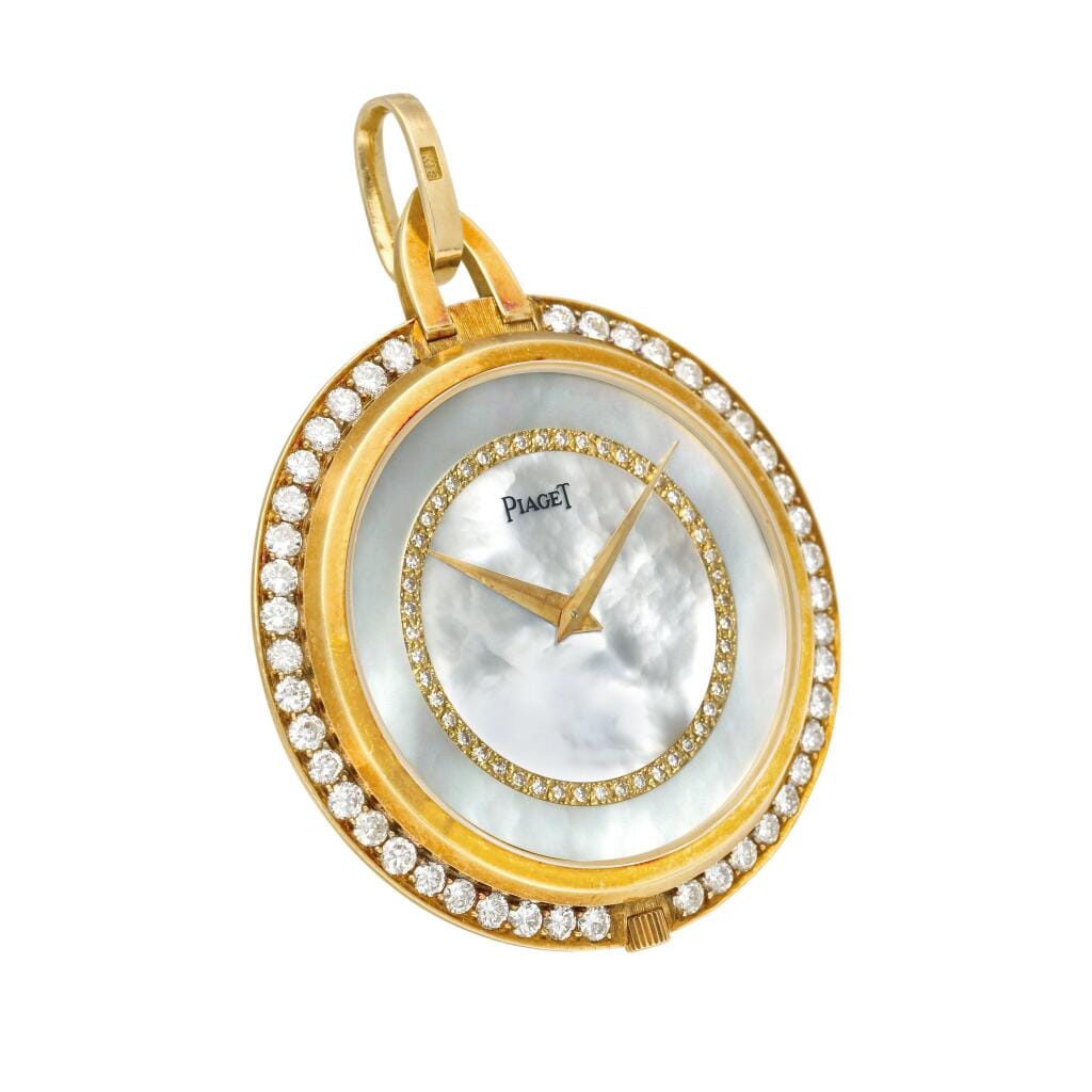 Piaget. A yellow gold and diamond-set open face manual wind watch with mother-of-pearl dial. Circa 1970