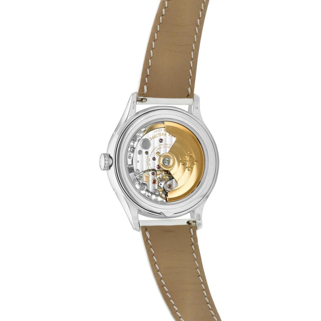 Complications (Reference 4947). A 38mm white gold diamond-set automatic wristwatch with date, day, month, moon phase, and annual calendar. 2019