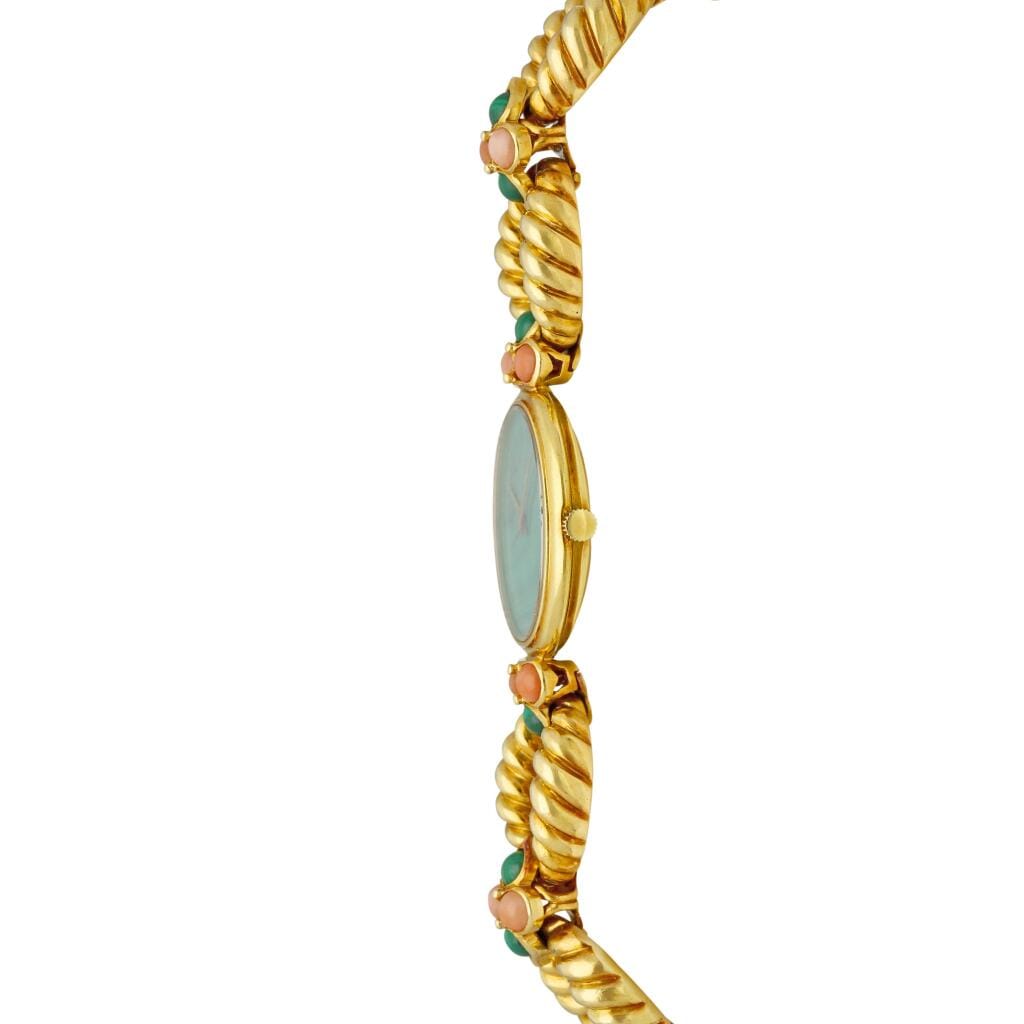 Piaget (Reference 94151 R21). A yellow gold, malachite and coral-set mechanical bracelet watch with malachite dial. Circa 1975