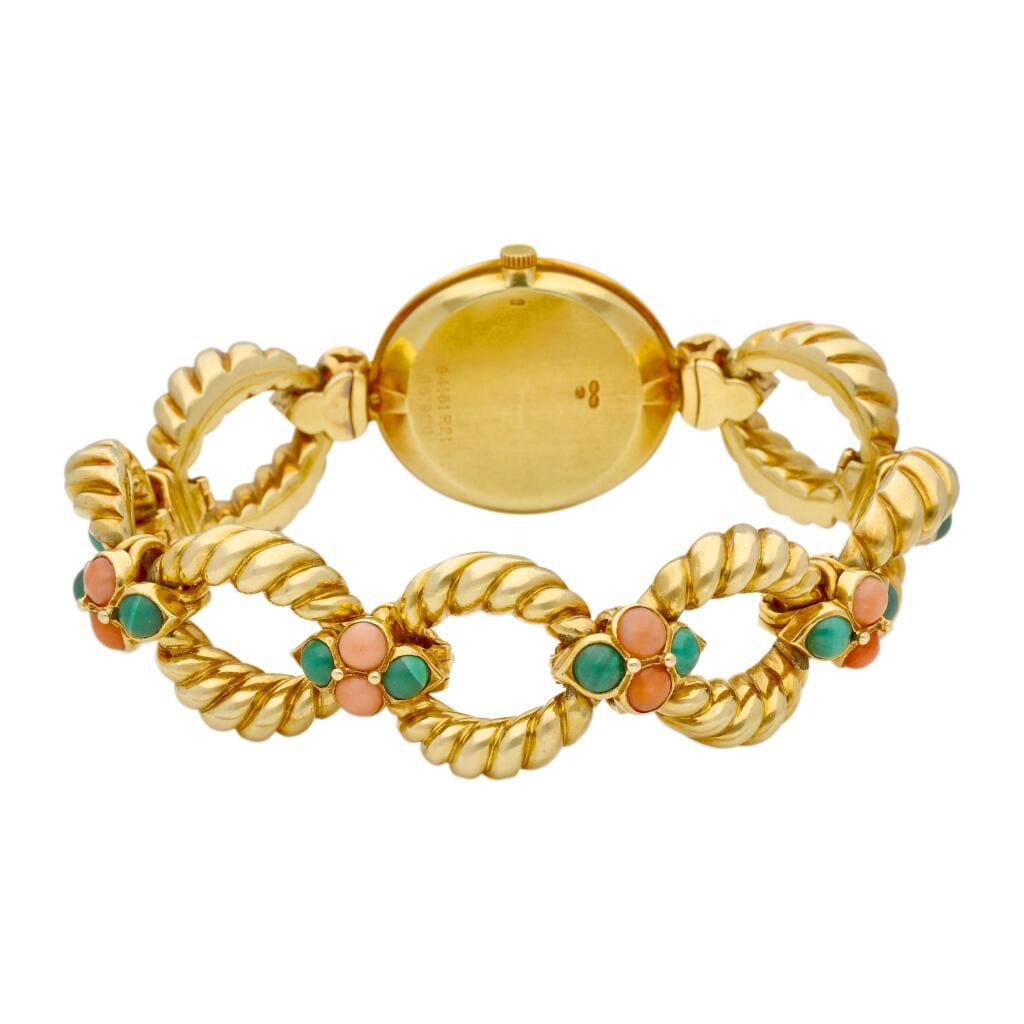 Piaget (Reference 94151 R21). A yellow gold, malachite and coral-set mechanical bracelet watch with malachite dial. Circa 1975