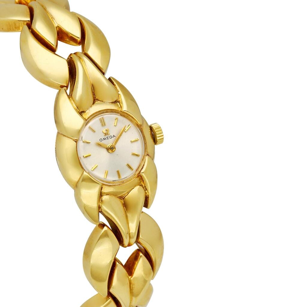 Omega; A gold bracelet watch with original certificate. Circa 1970