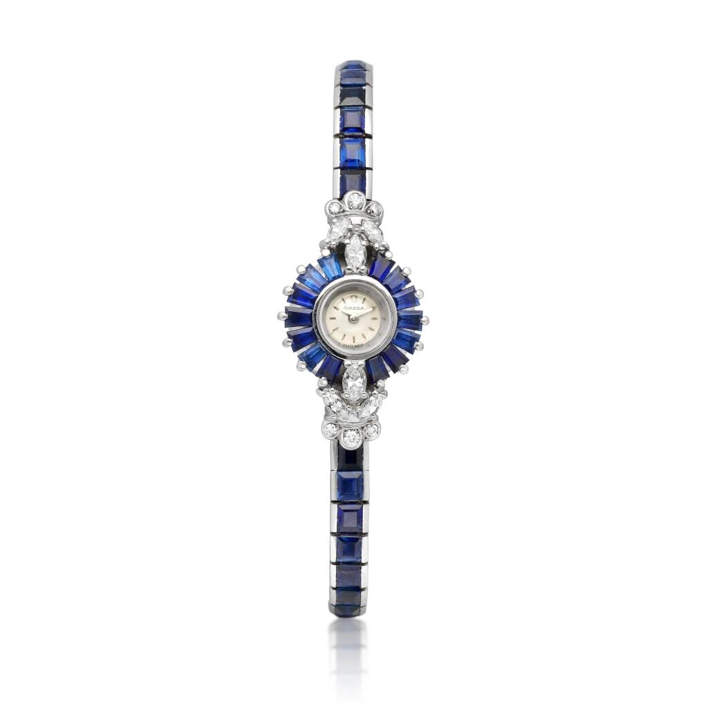 Omega. A white gold, diamond and sapphire-set manual wind bracelet watch. Circa 1960