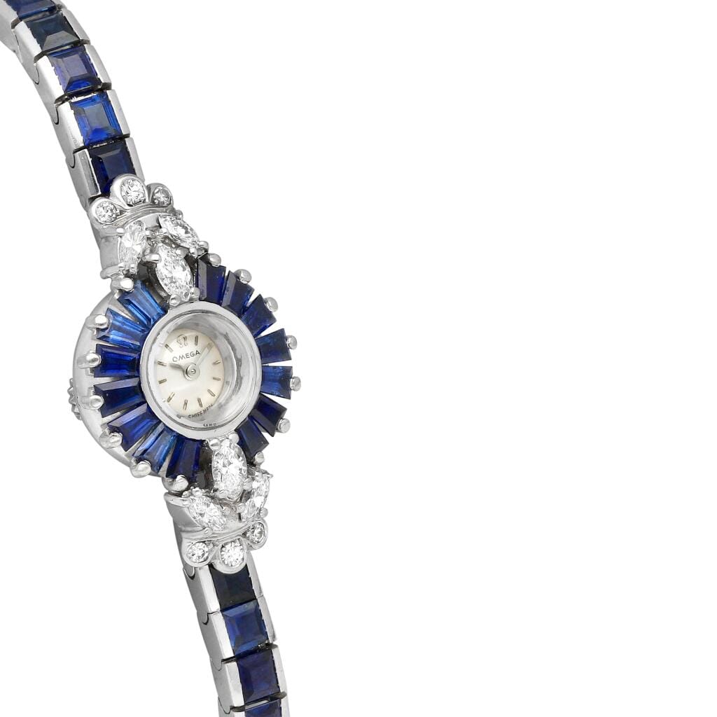 Omega. A white gold, diamond and sapphire-set manual wind bracelet watch. Circa 1960