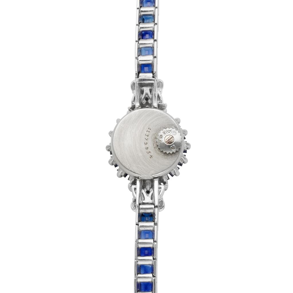 Omega. A white gold, diamond and sapphire-set manual wind bracelet watch. Circa 1960