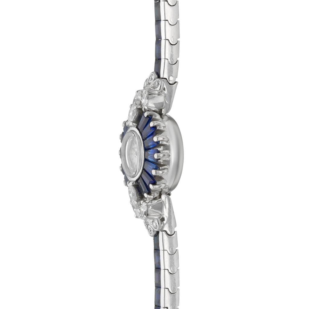 Omega. A white gold, diamond and sapphire-set manual wind bracelet watch. Circa 1960