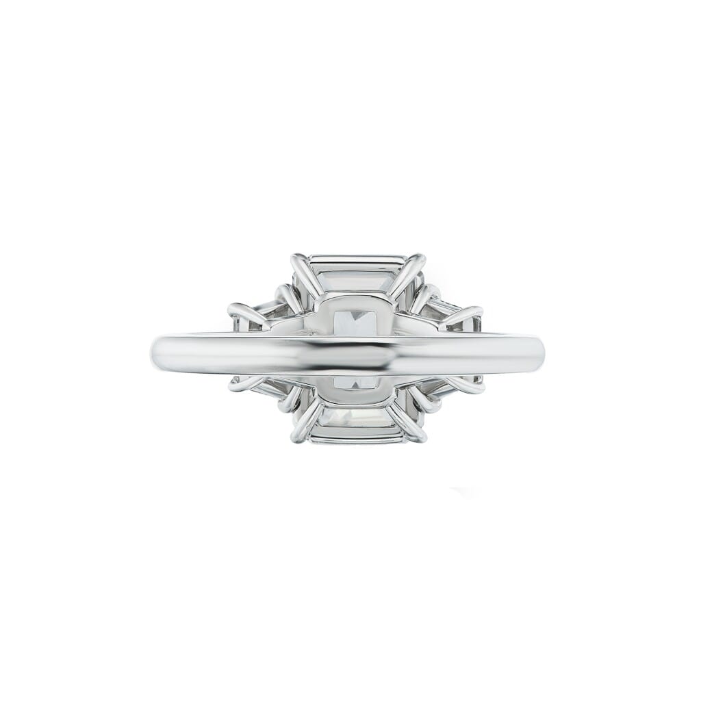 Platinum and 4.02ct Emerald Cut Diamond and Diamond Three Stone Engagement Ring