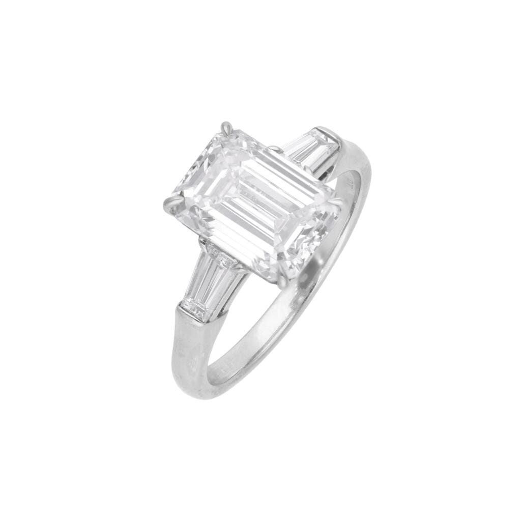 Platinum and 3.01ct Emerald Cut Diamond Three Stone Engagement Ring