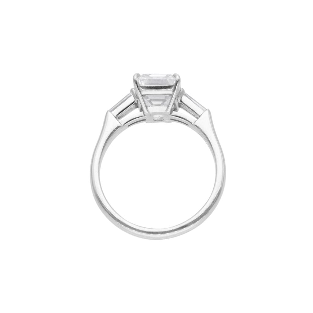 Platinum and 3.01ct Emerald Cut Diamond Three Stone Engagement Ring