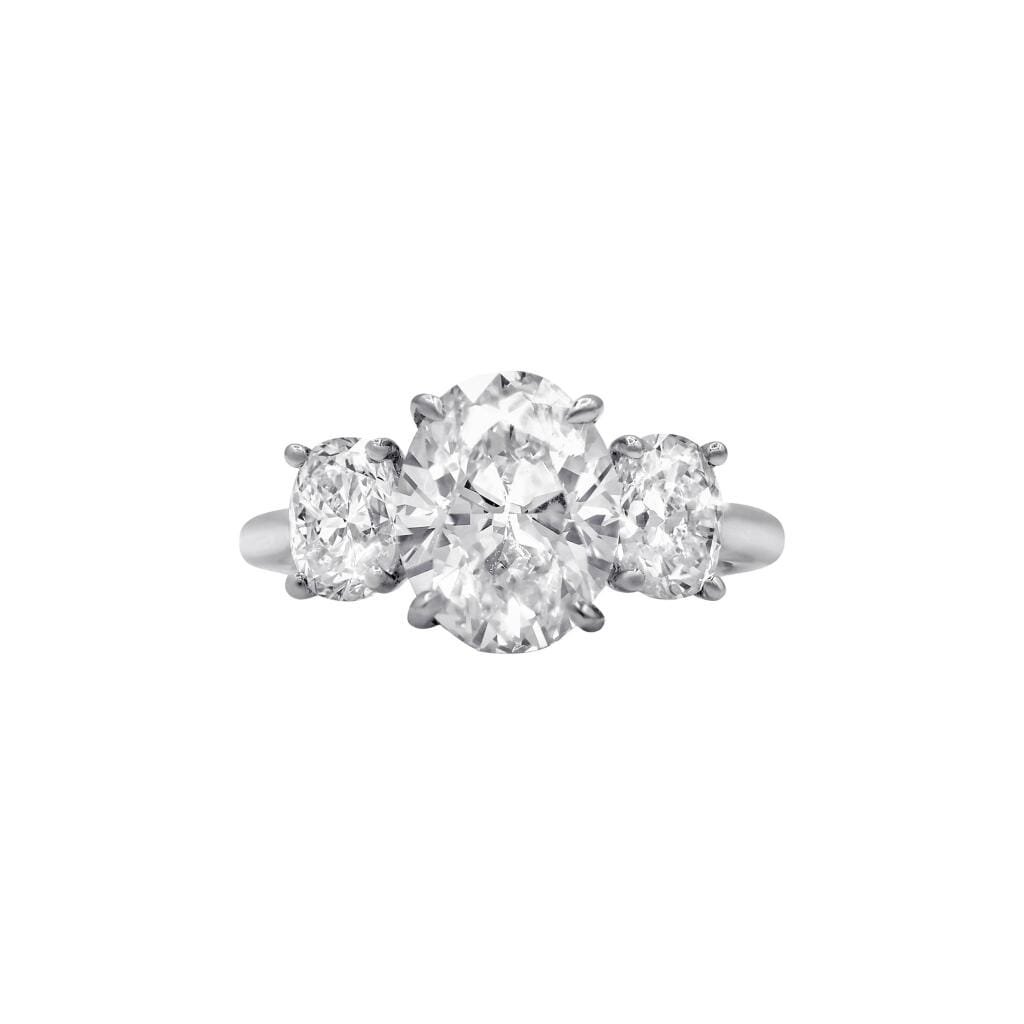 Platinum, 3.26ct Oval Cut Diamond and Diamond Three Stone Engagement Ring