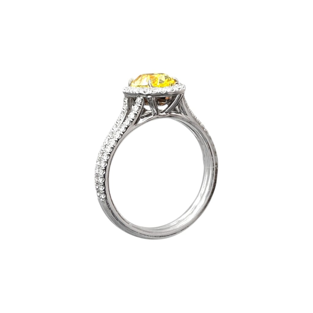Platinum, Gold, 1.47ct Oval Cut Fancy Intense Yellow Diamond and Diamond Ring