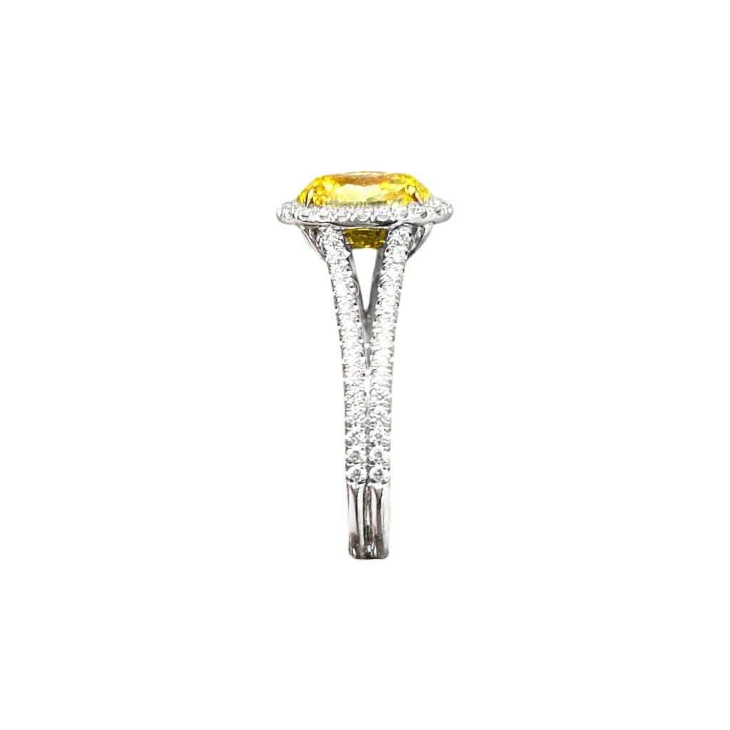 Platinum, Gold, 1.47ct Oval Cut Fancy Intense Yellow Diamond and Diamond Ring