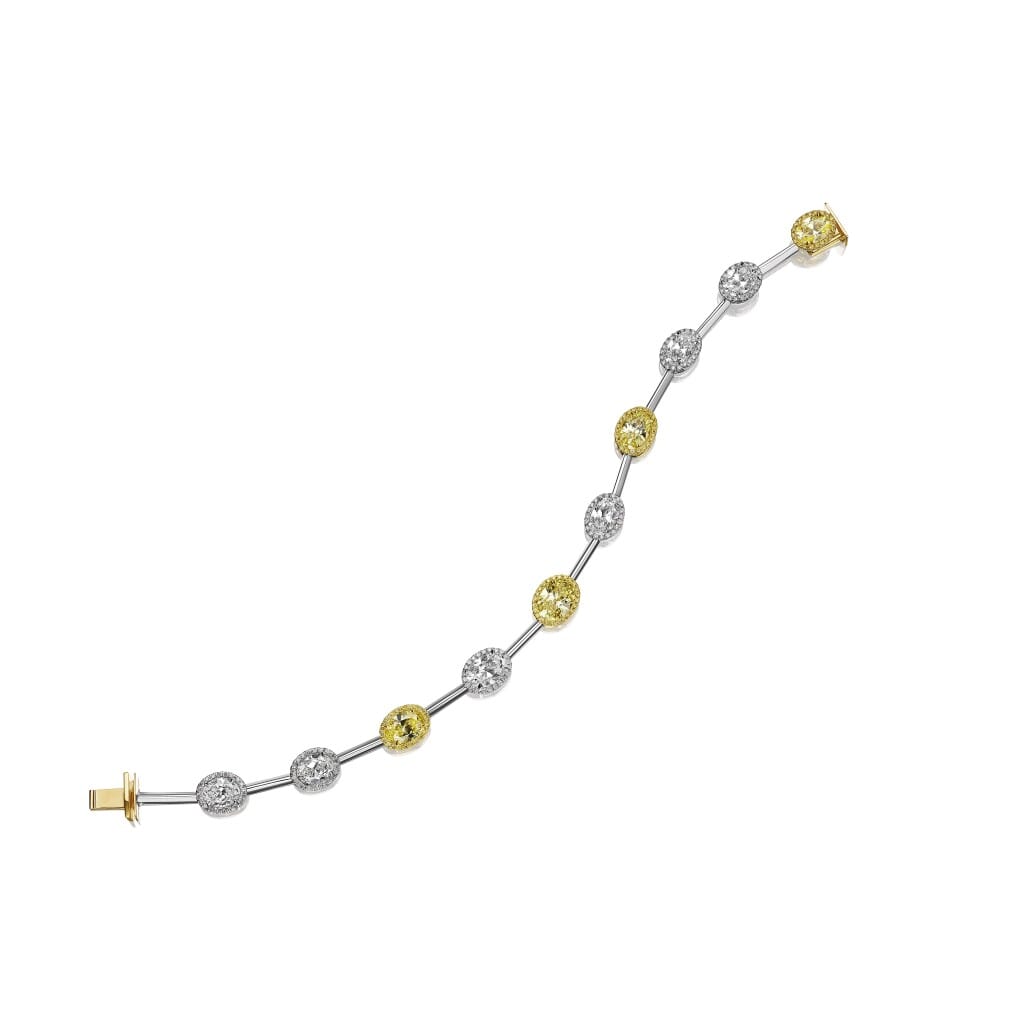 Platinum, Gold, 3.59ctw Oval Cut Fancy Vivid Yellow Diamond, 4.66ctw Oval Cut Diamond and Diamond Station Bracelet