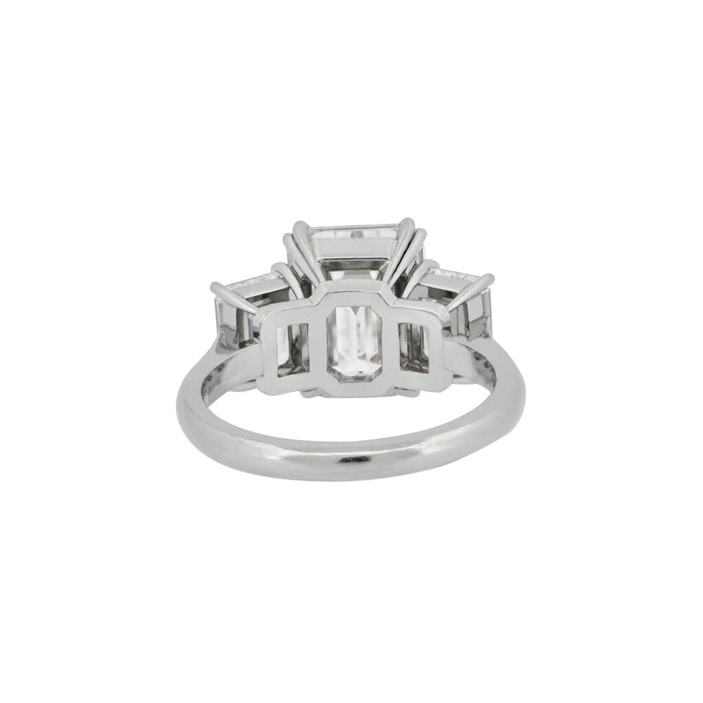 Platinum, 4.02ct Emerald Cut Diamond and Diamond Three Stone Engagement Ring