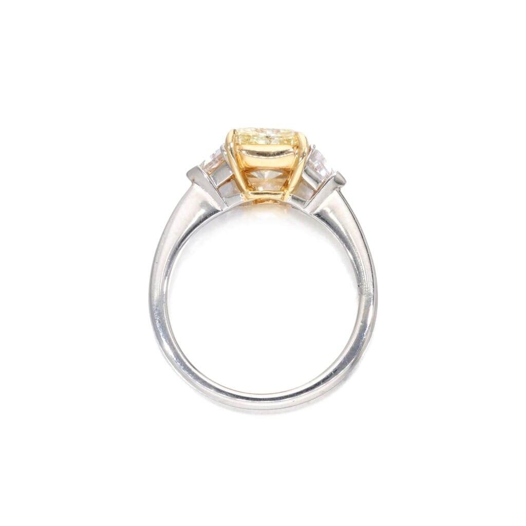 Platinum, Gold, 2.03ct Radiant Cut Fancy Yellow Diamond and Diamond Three Stone Ring
