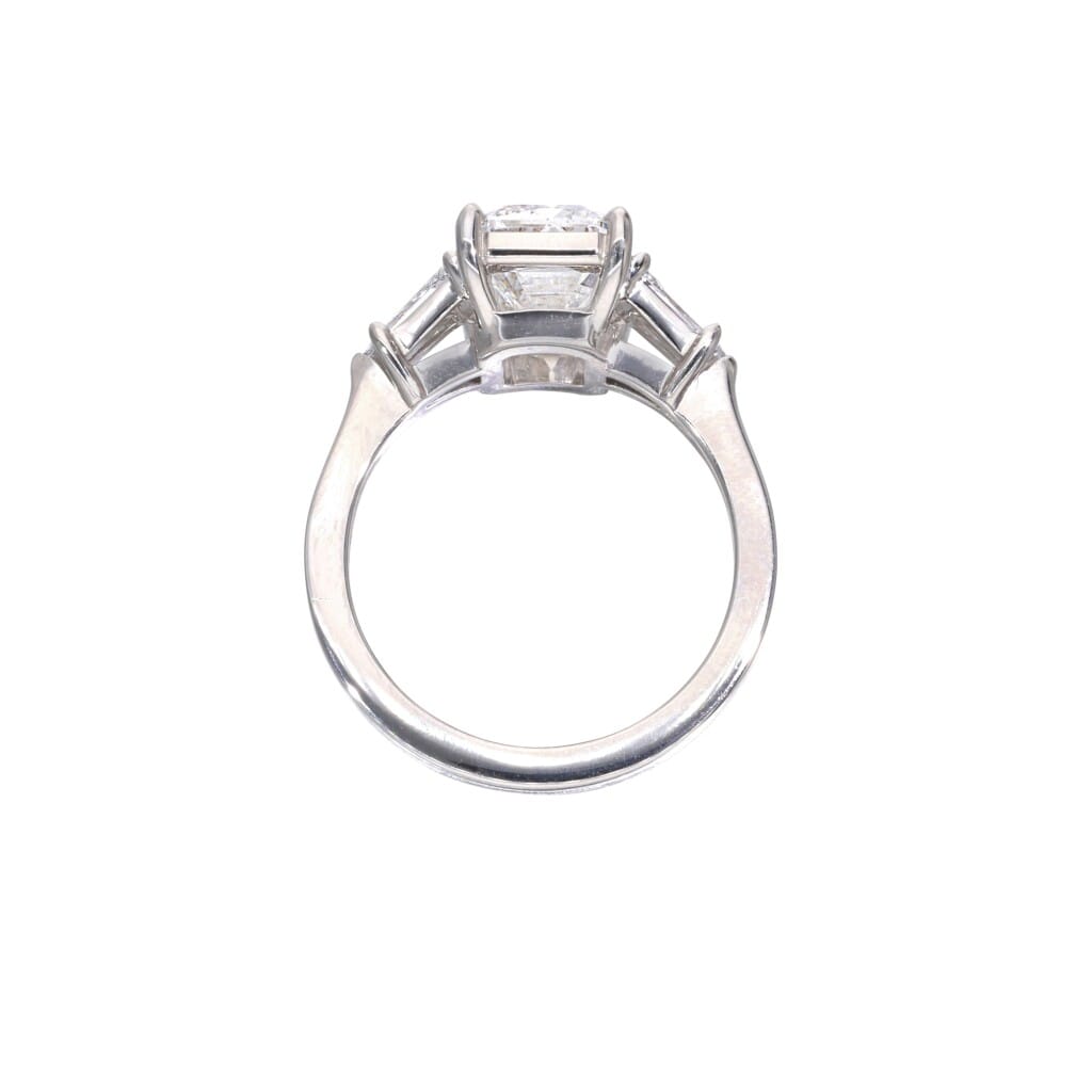 Platinum, 3.61ct Emerald Cut Diamond and Diamond Engagement Three Stone Ring