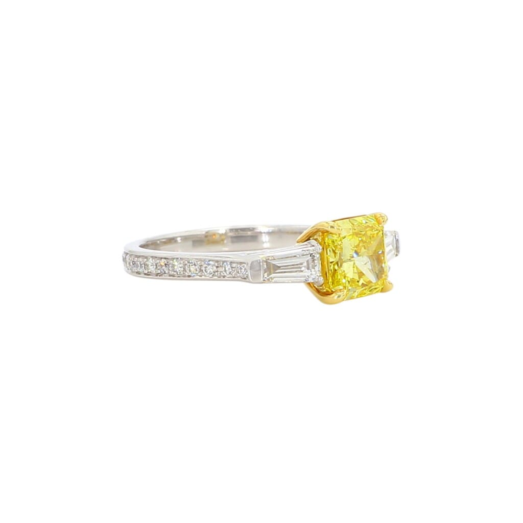 White Gold, 1.18ct Radiant Cut Fancy Vivid Yellow Diamond and Diamond Three Stone Engagement Ring