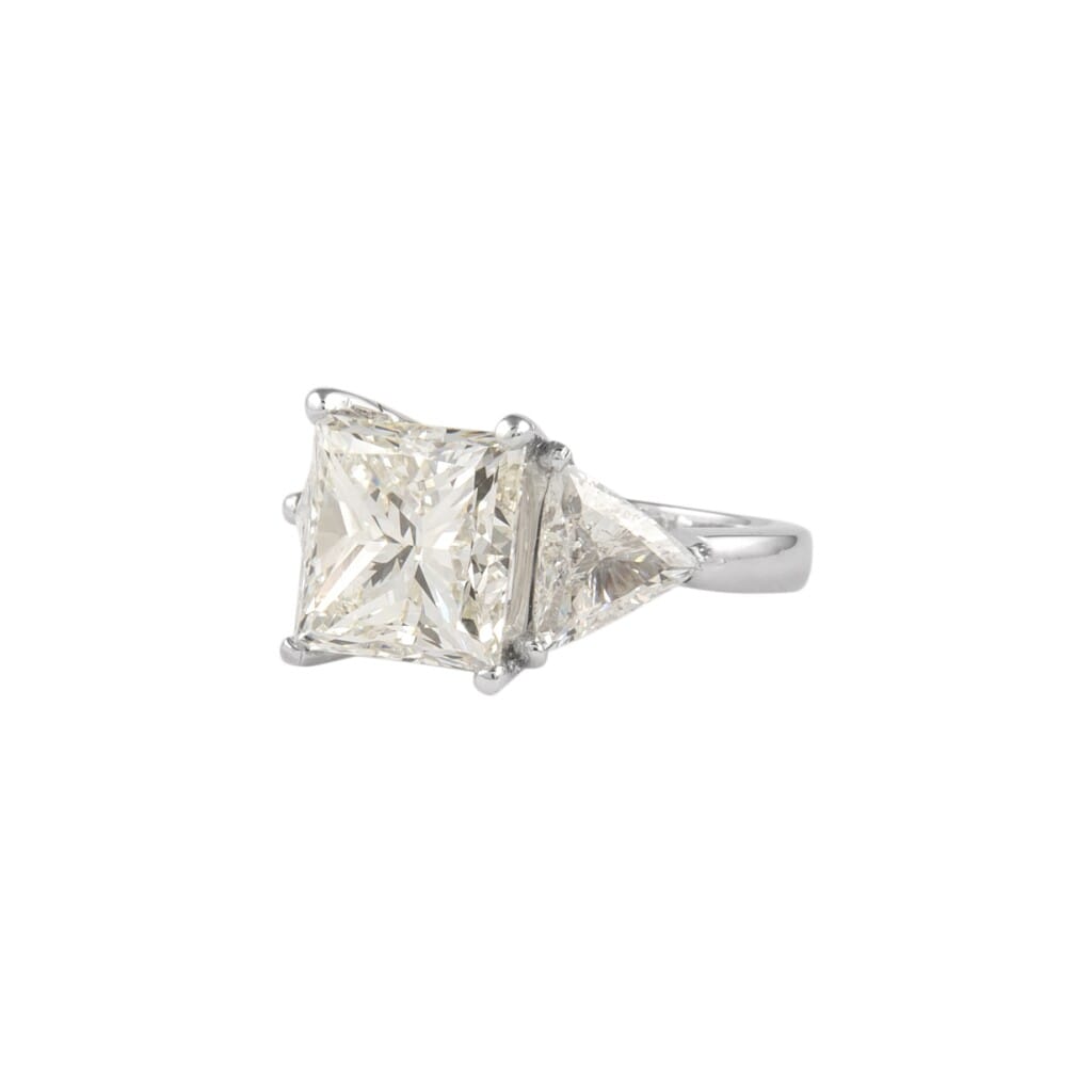 Platinum, 6.05ct Princess Cut Diamond and Diamond Three Stone Ring
