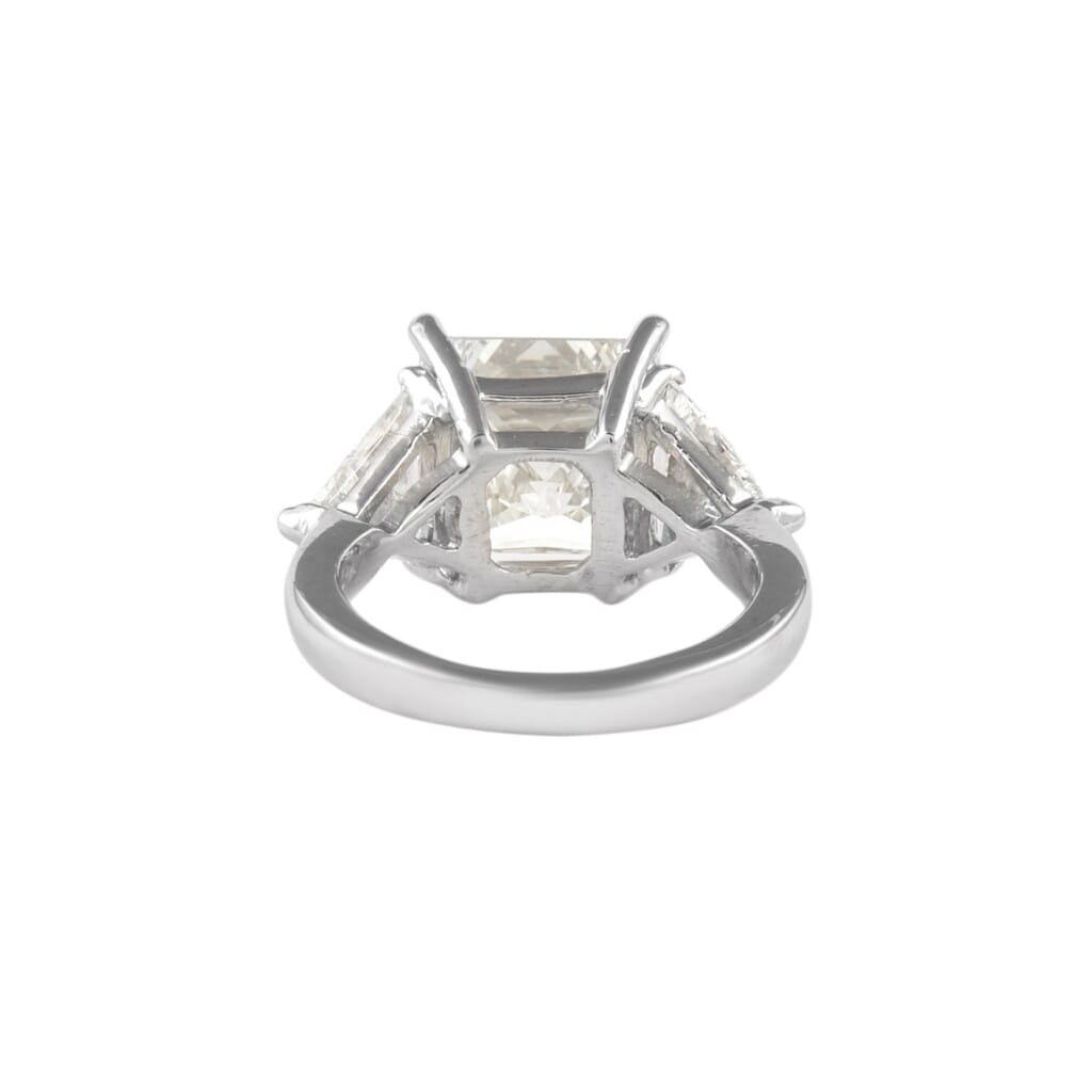 Platinum, 6.05ct Princess Cut Diamond and Diamond Three Stone Ring
