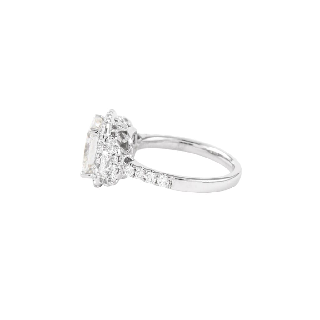 White Gold, 3.05ct Cushion Cut Diamond and Diamond Three Stone Ring