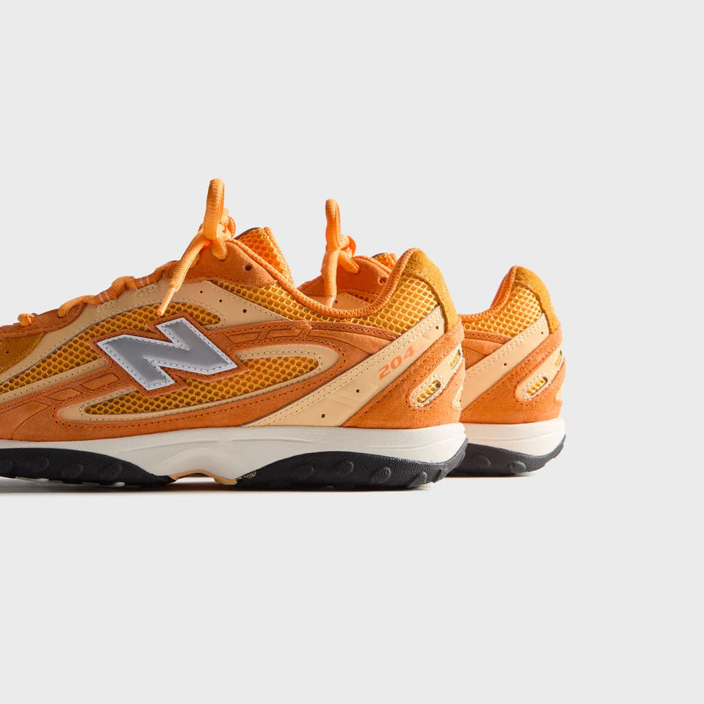 New Balance 204 l Kith Orange