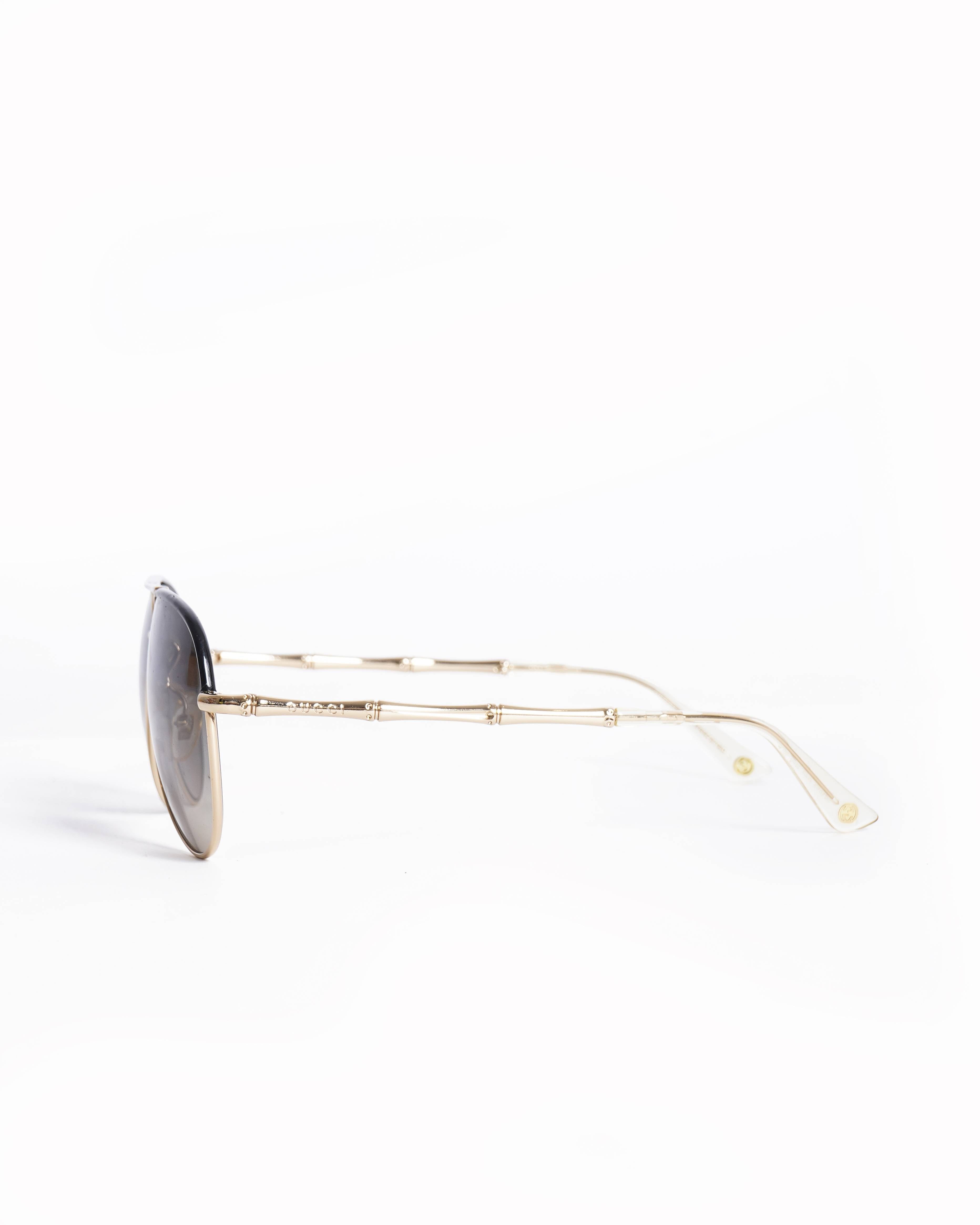 Gucci New Gucci men's sunglasses in gold/black frame