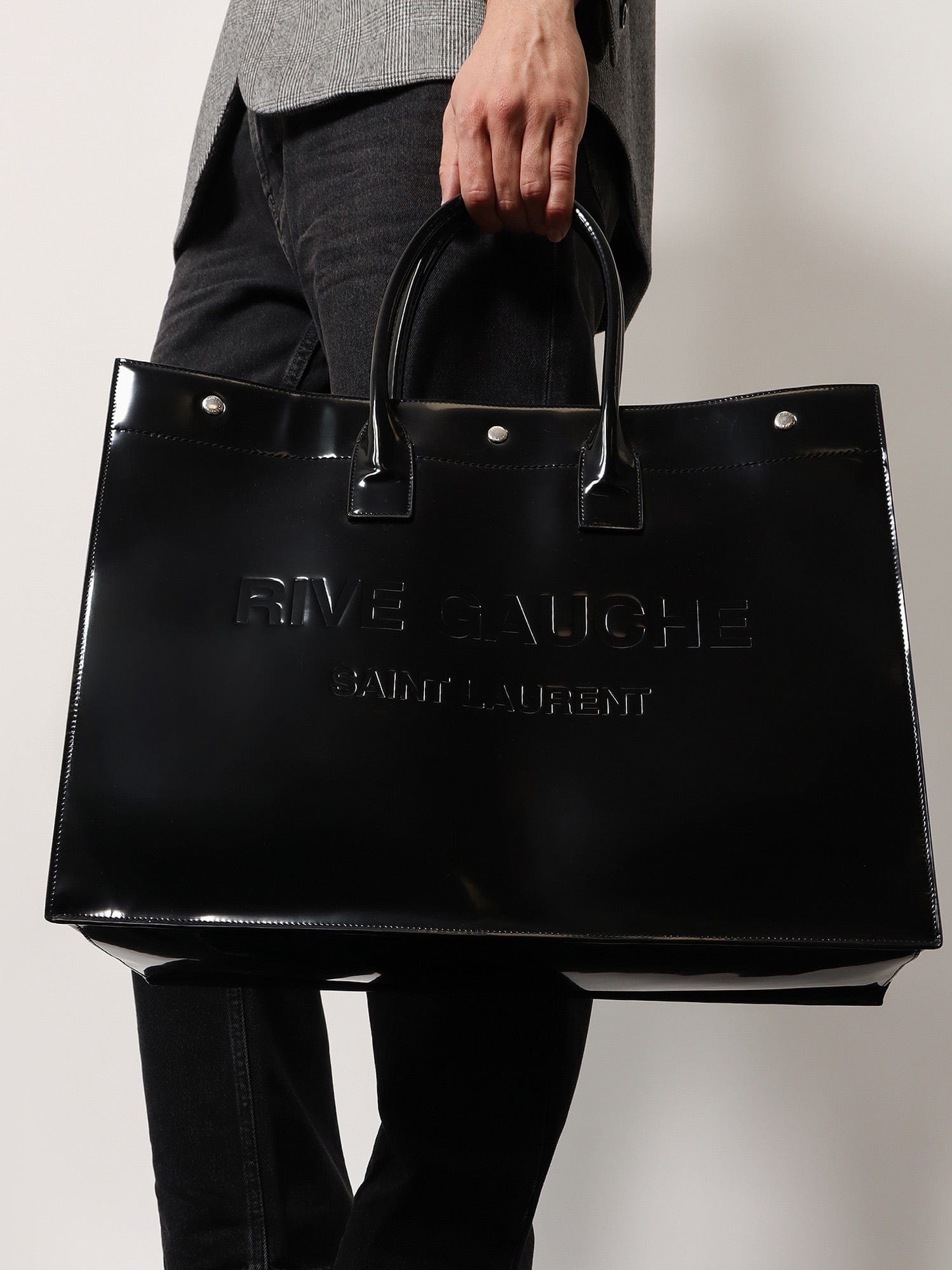 Saint Laurent Patent leather handbag with embossed logo