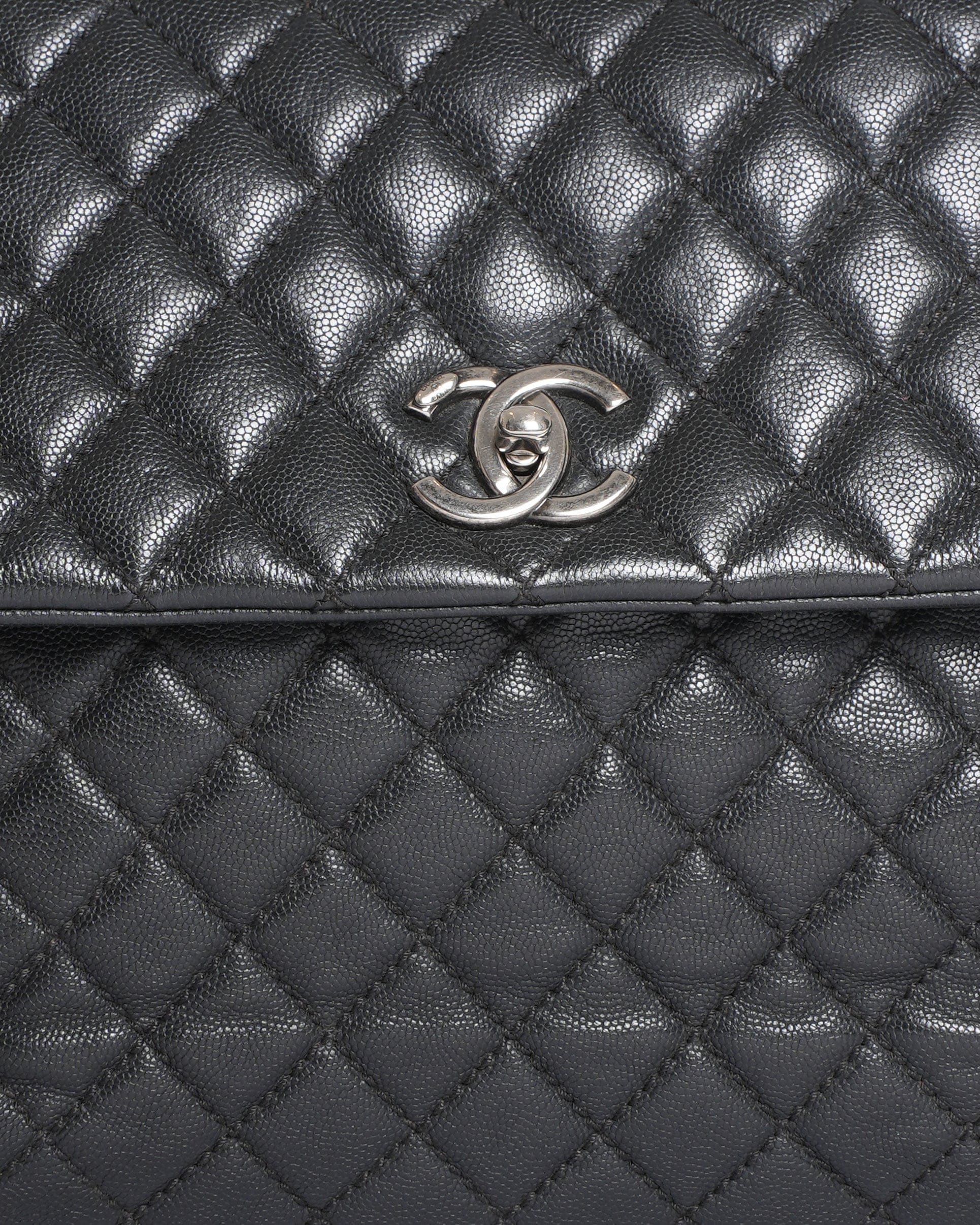 Chanel Quilted Caviar Coco Handle Bag in Black